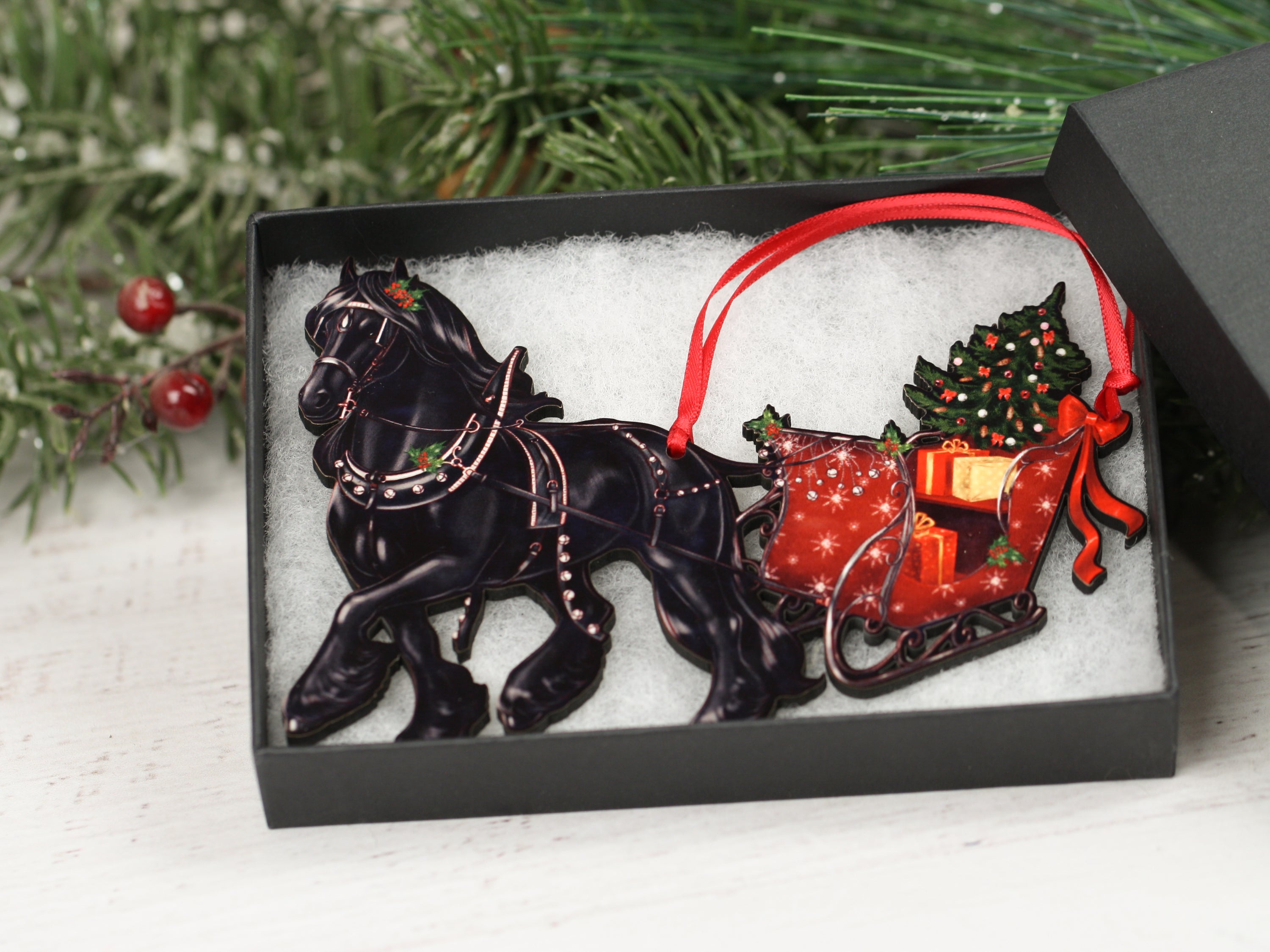 Friesian Horse Christmas Ornament featuring a black horse pulling a sleigh, handmade from composite wood with a glossy finish.