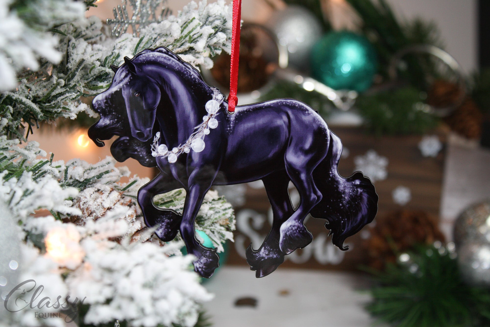 A beautifully crafted black Friesian horse ornament with a white wreath, perfect for Christmas decoration.