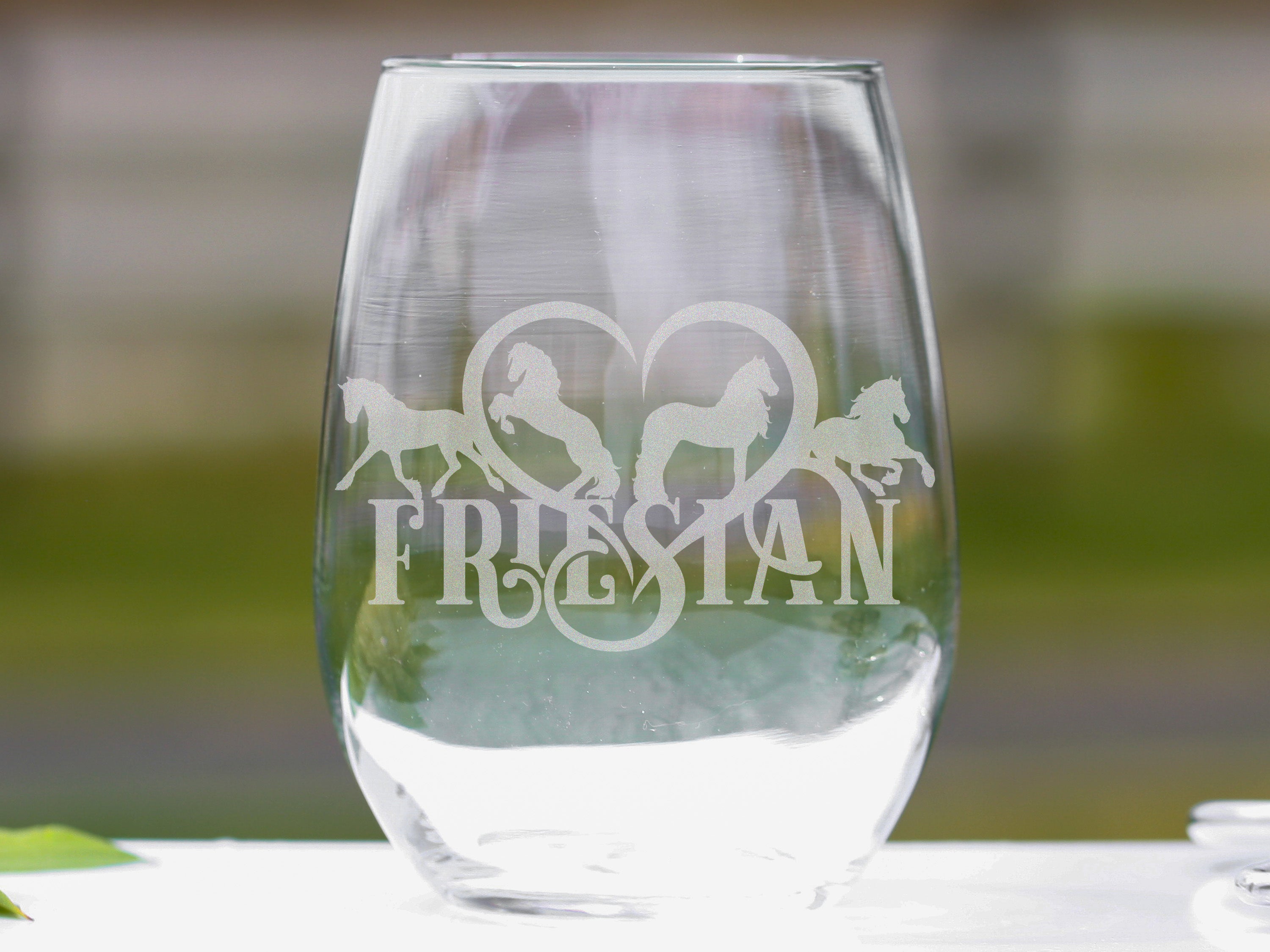 Elegant stemless wine glasses featuring a Friesian horse heart design, perfect for wine lovers.