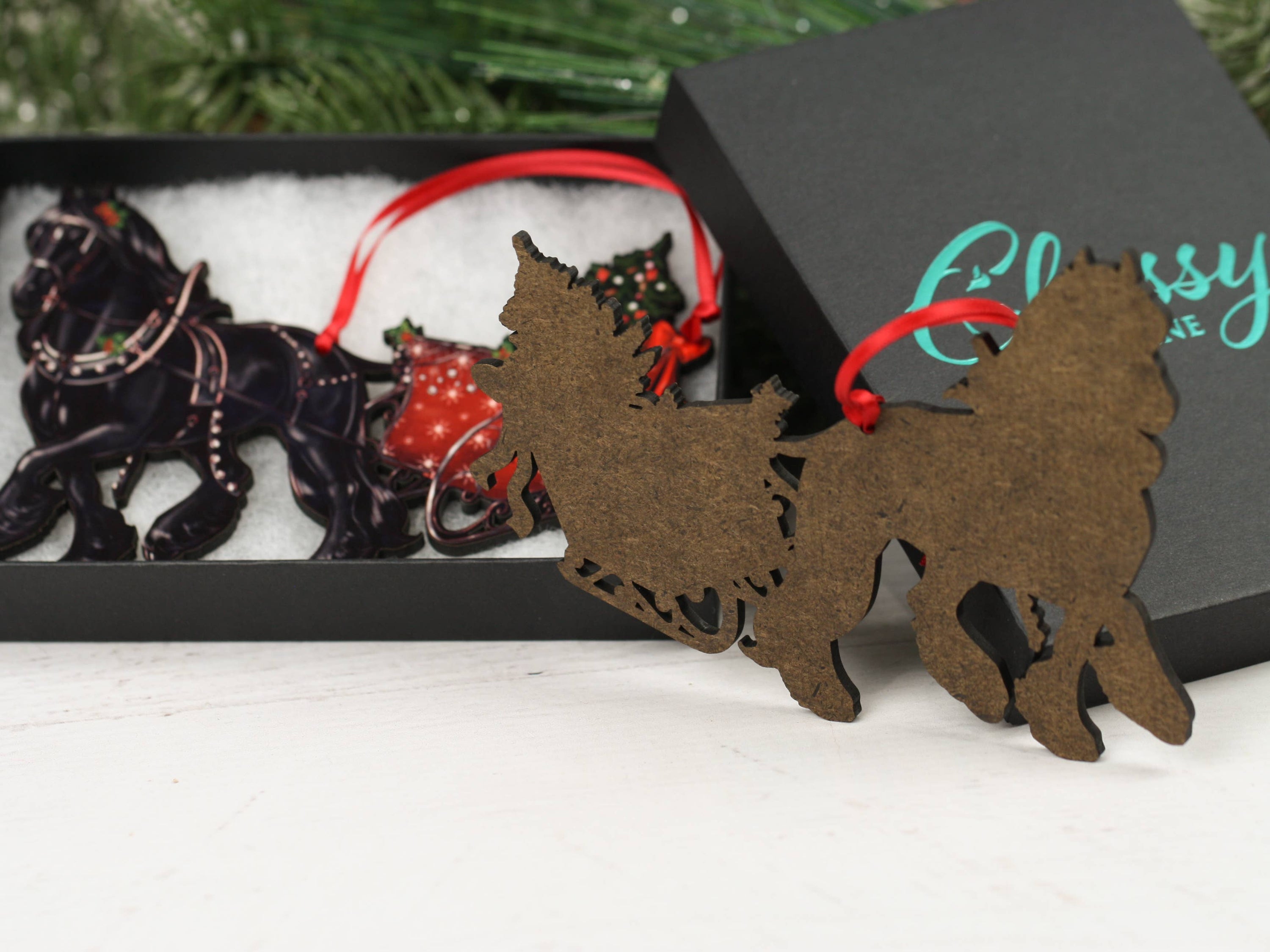 Elegant Friesian Horse sleigh ornament, handmade from composite wood, featuring a glossy finish and intricate laser-cut design.