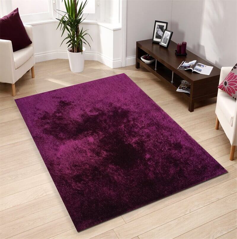 Fuzzy Magenta Area Rug showcasing a soft shaggy texture in a vibrant magenta color, perfect for home decor.