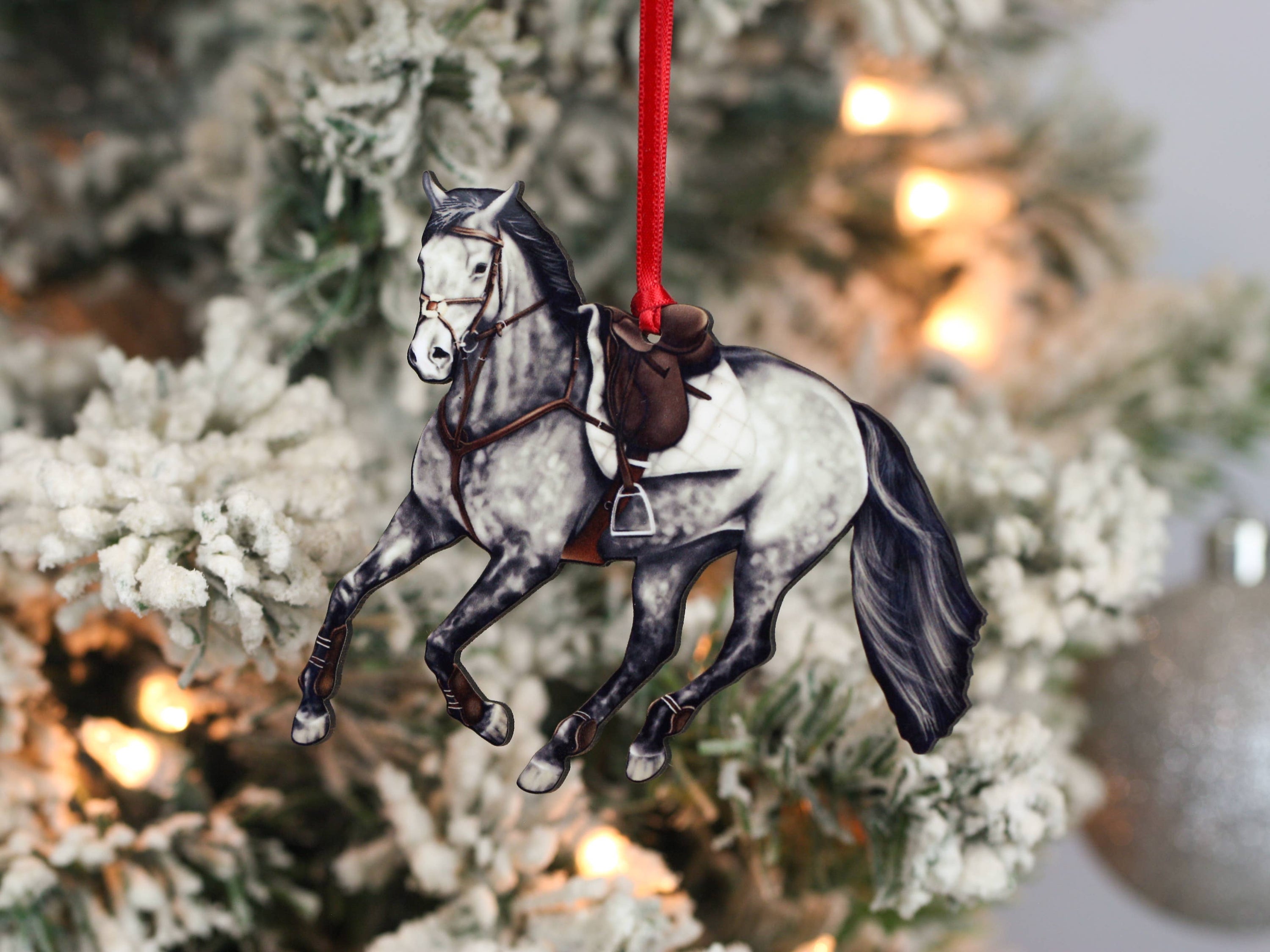 Galloping Gray Hunter Jumper Horse Ornament with red and black ribbons, showcasing intricate details and glossy finish.