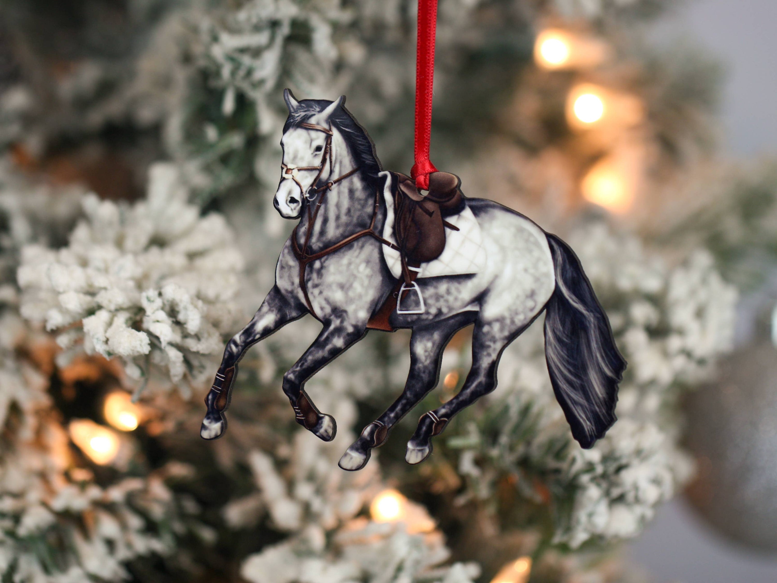 Galloping Gray Hunter Jumper Horse Ornament with red and black ribbons, showcasing intricate details and glossy finish.