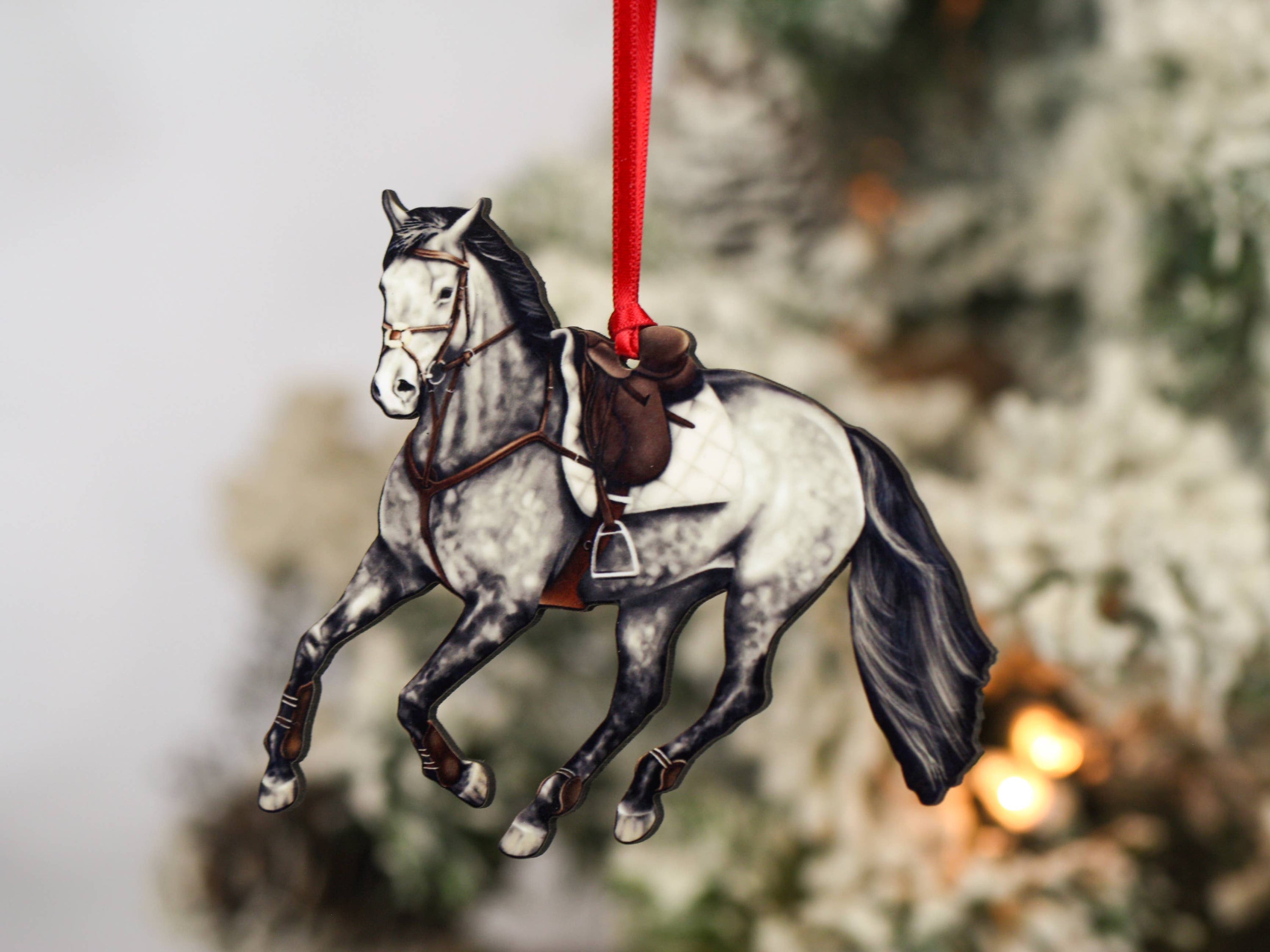 Galloping Gray Hunter Jumper Horse Ornament with red and black ribbons, showcasing intricate details and glossy finish.