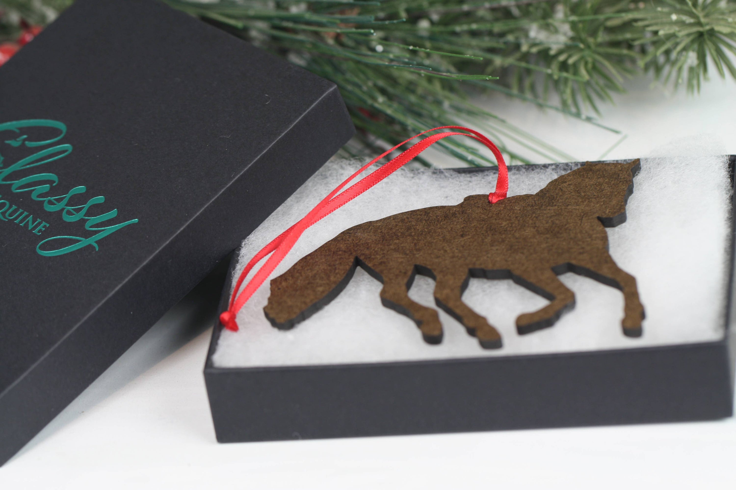 Galloping Gray Hunter Jumper Horse Ornament with red and black ribbons, showcasing intricate details and glossy finish.