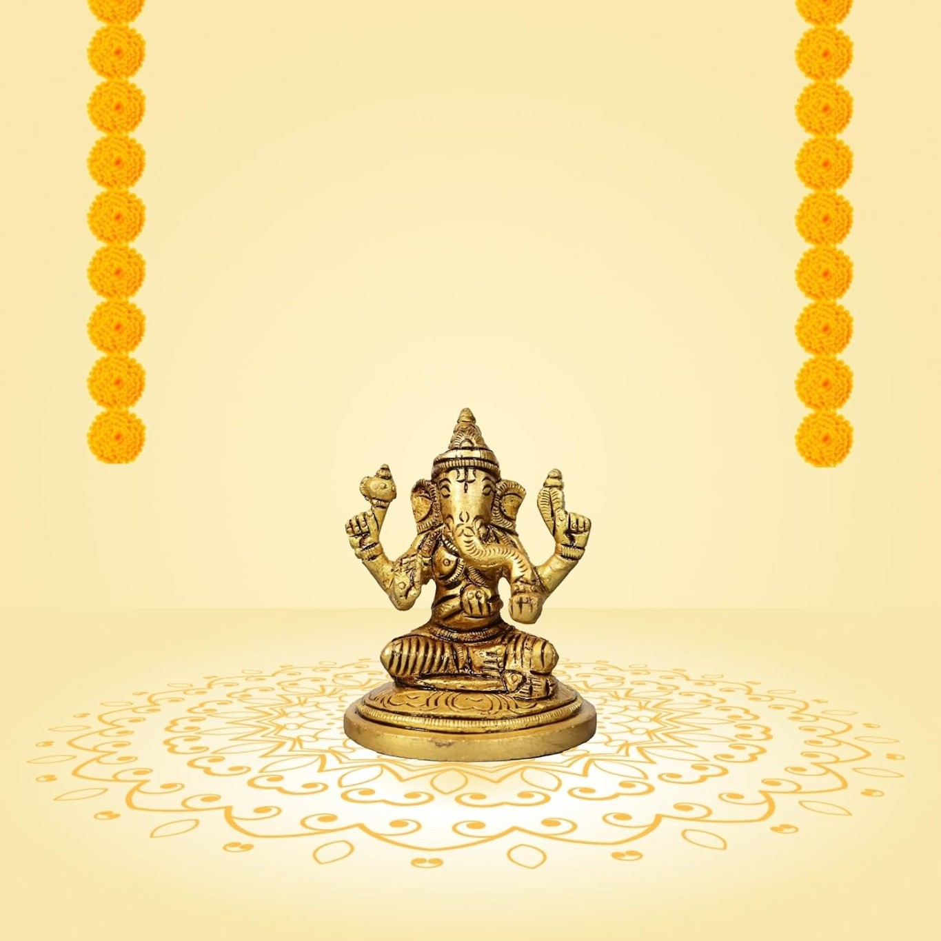 Small brass Ganesha idol with antique gold finish, intricately designed, standing 2.75 inches tall.