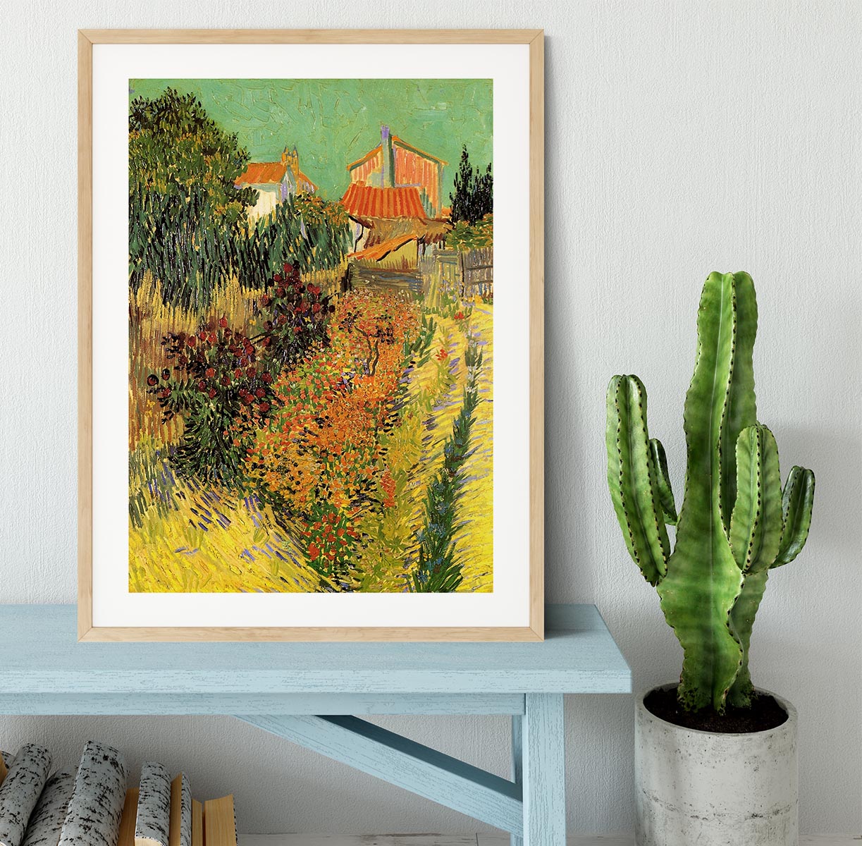 Framed print of Van Gogh's Garden Behind a House, showcasing vibrant colors and intricate details in a stylish frame.