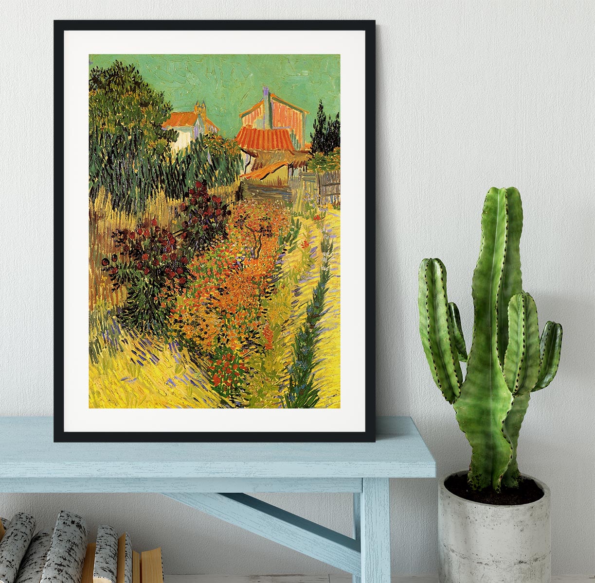 Framed print of Van Gogh's Garden Behind a House, showcasing vibrant colors and intricate details in a stylish frame.