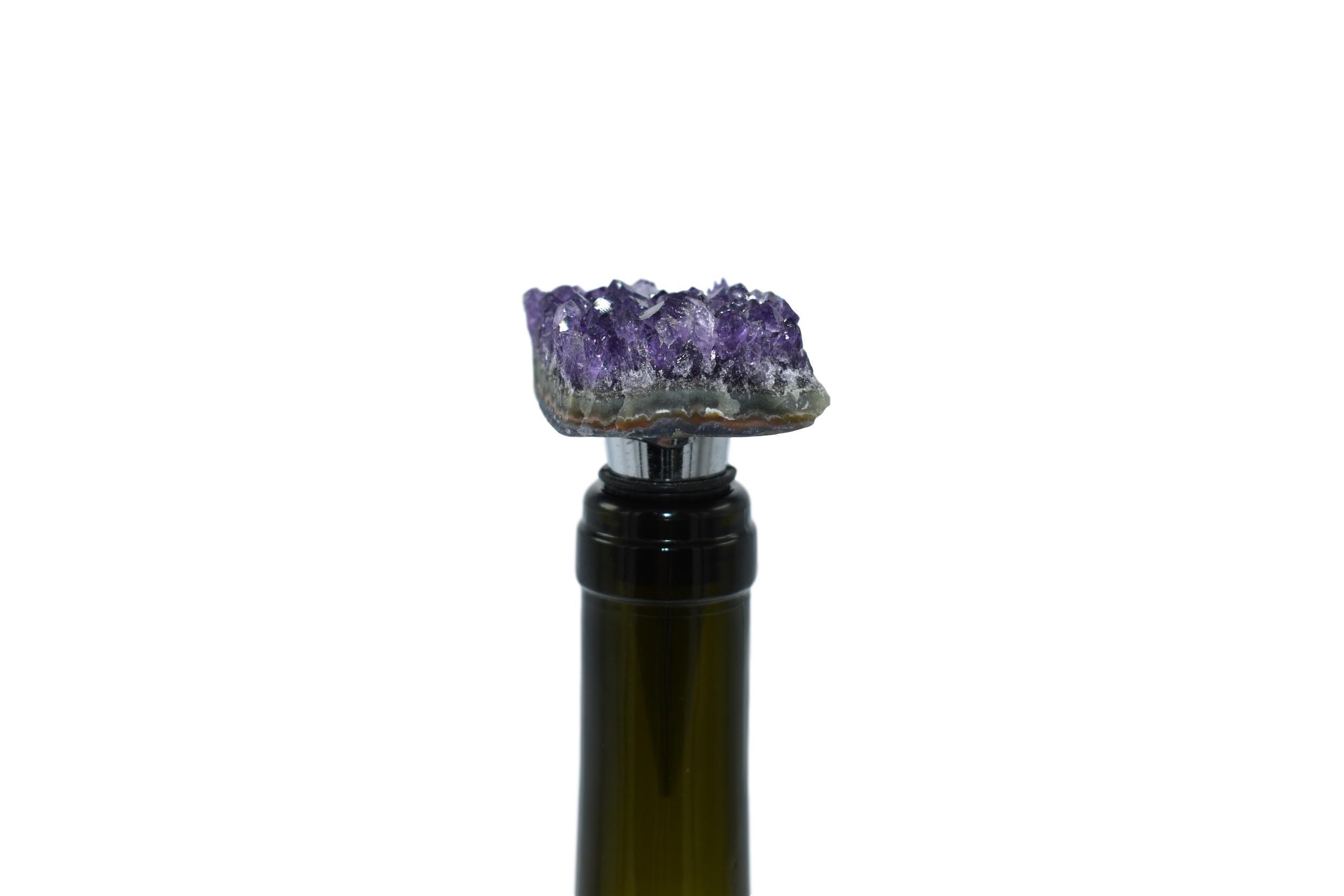 Elegant gemstone wine stoppers with stainless steel base and silicone seal, featuring rose quartz, white quartz, amethyst, and pyrite options.