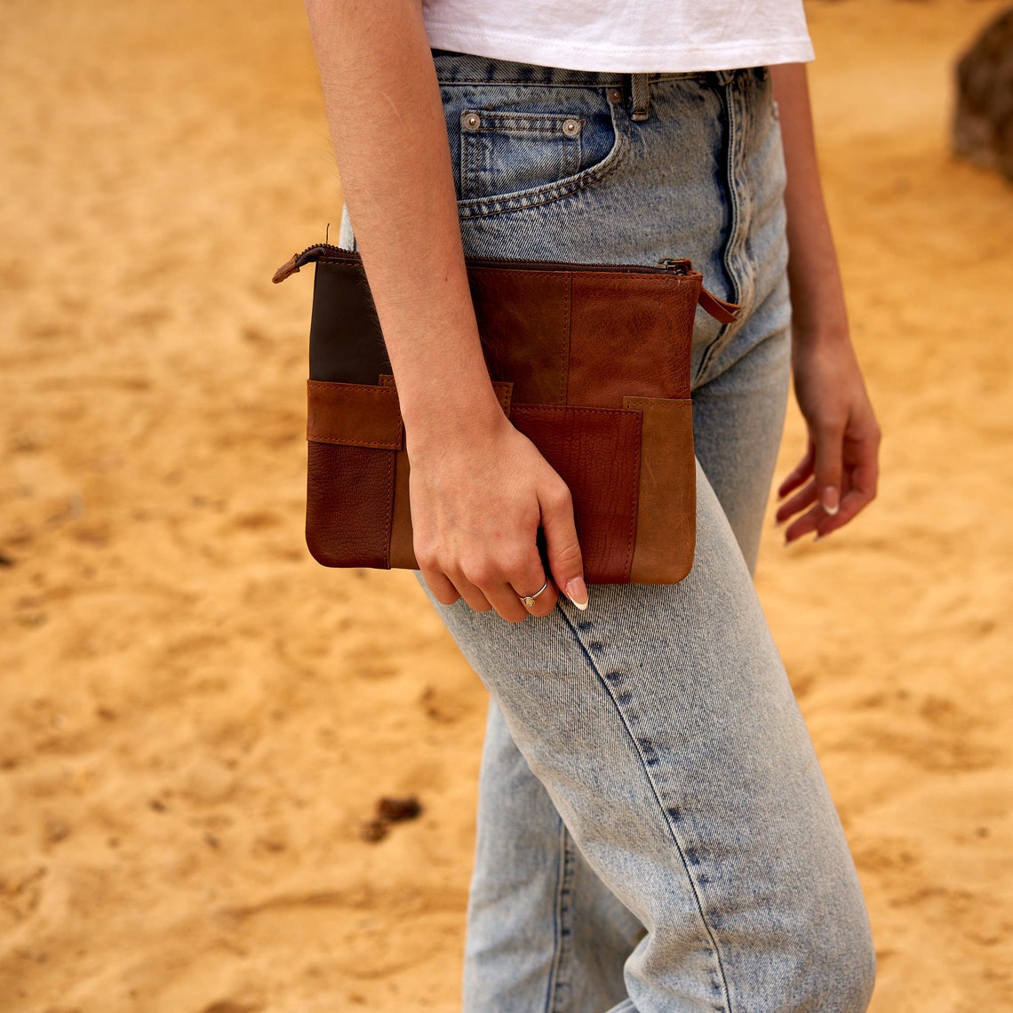 Genuine leather patchwork clutch showcasing unique design and high-quality craftsmanship, perfect for storing essentials.