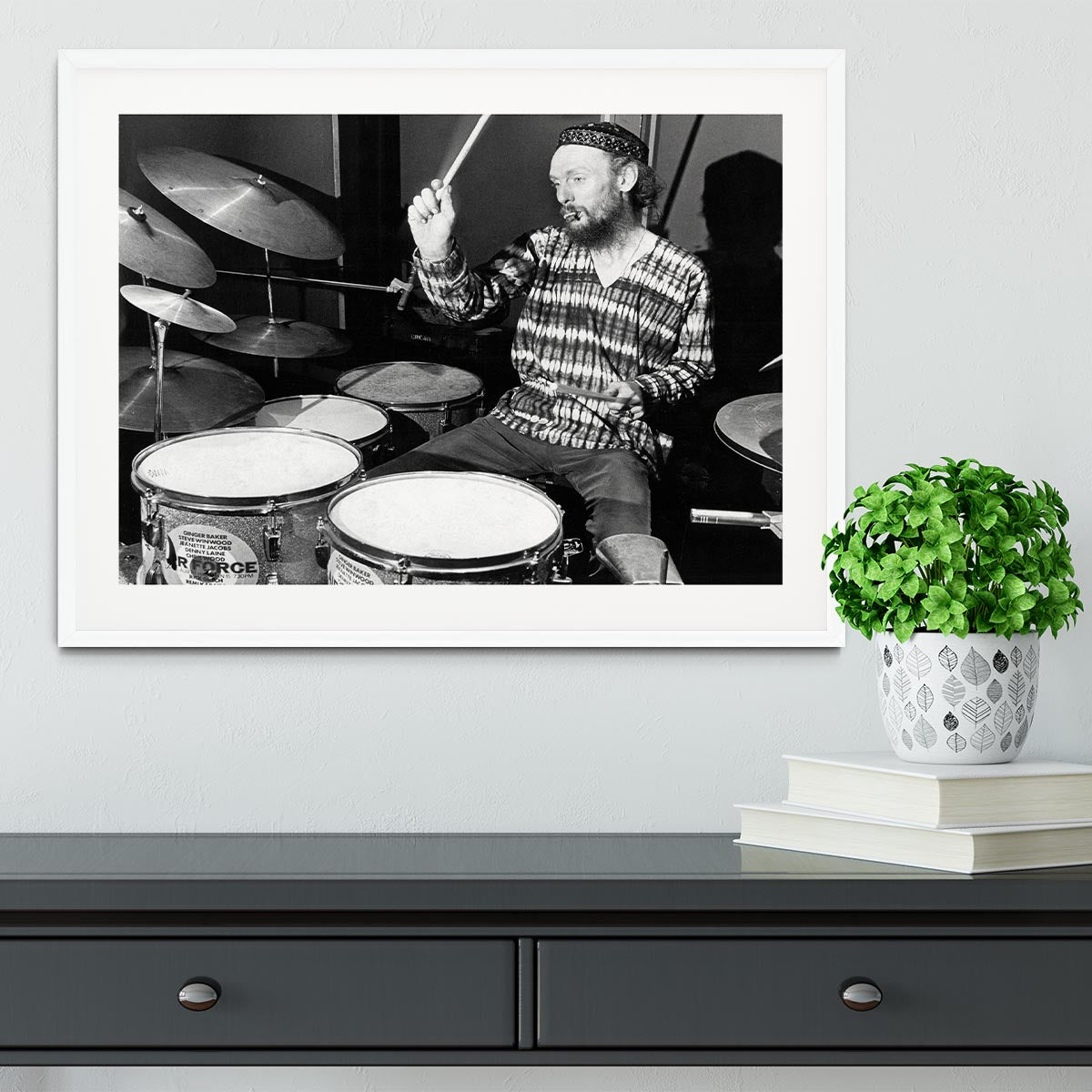 Framed print of Ginger Baker playing drums, showcasing vibrant colors and high-quality craftsmanship.