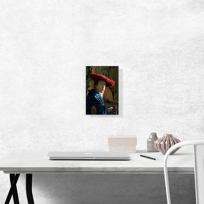 A beautiful canvas print of a girl wearing a striking red hat, showcasing elegance and artistic flair.