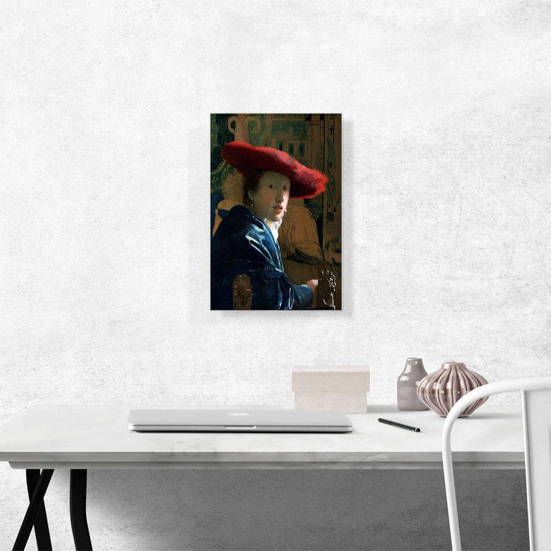 A beautiful canvas print of a girl wearing a striking red hat, showcasing elegance and artistic flair.