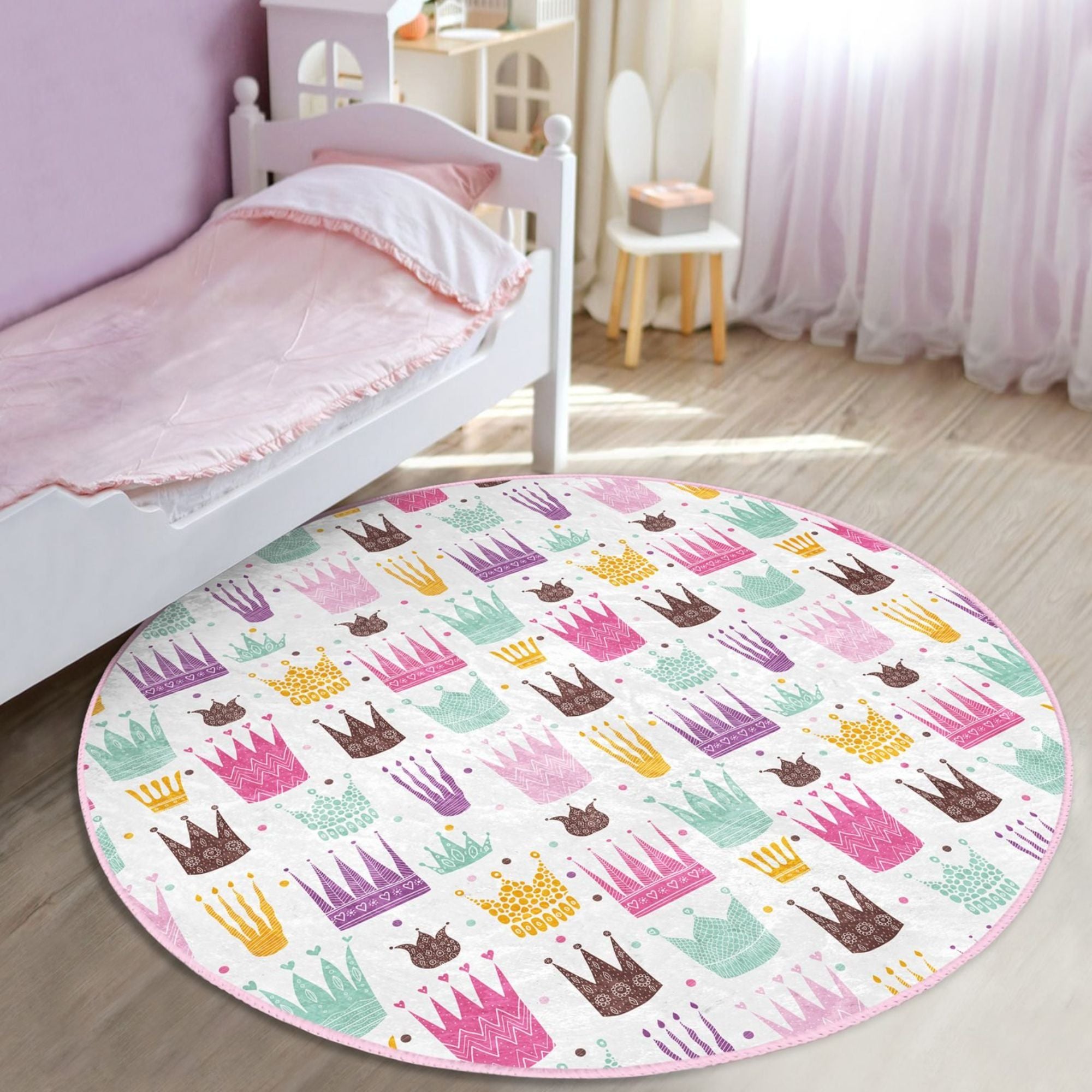 A beautiful washable rug featuring a princess crown pattern, perfect for a girl's room, made from high-quality polyester with vibrant colors.