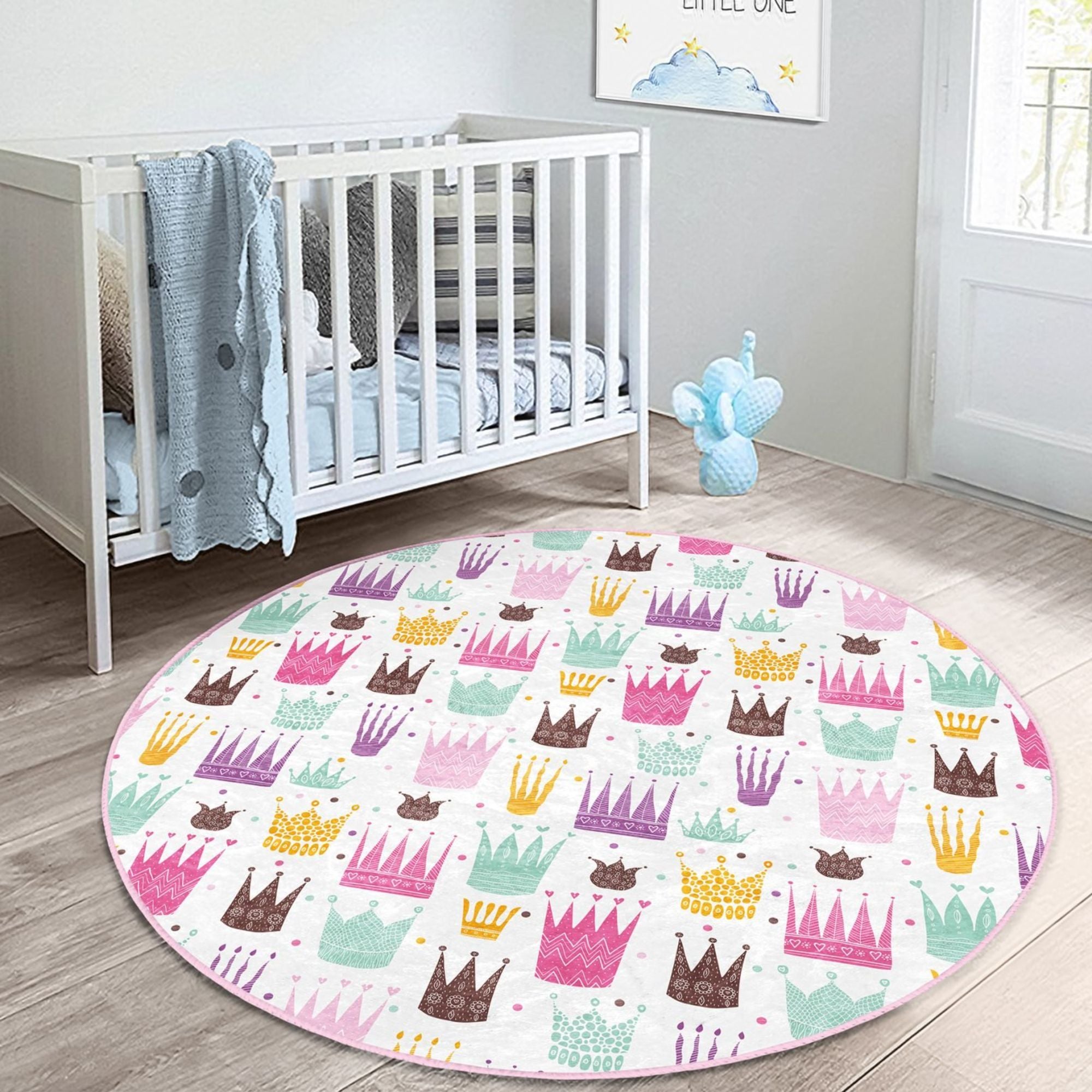 A beautiful washable rug featuring a princess crown pattern, perfect for a girl's room, made from high-quality polyester with vibrant colors.