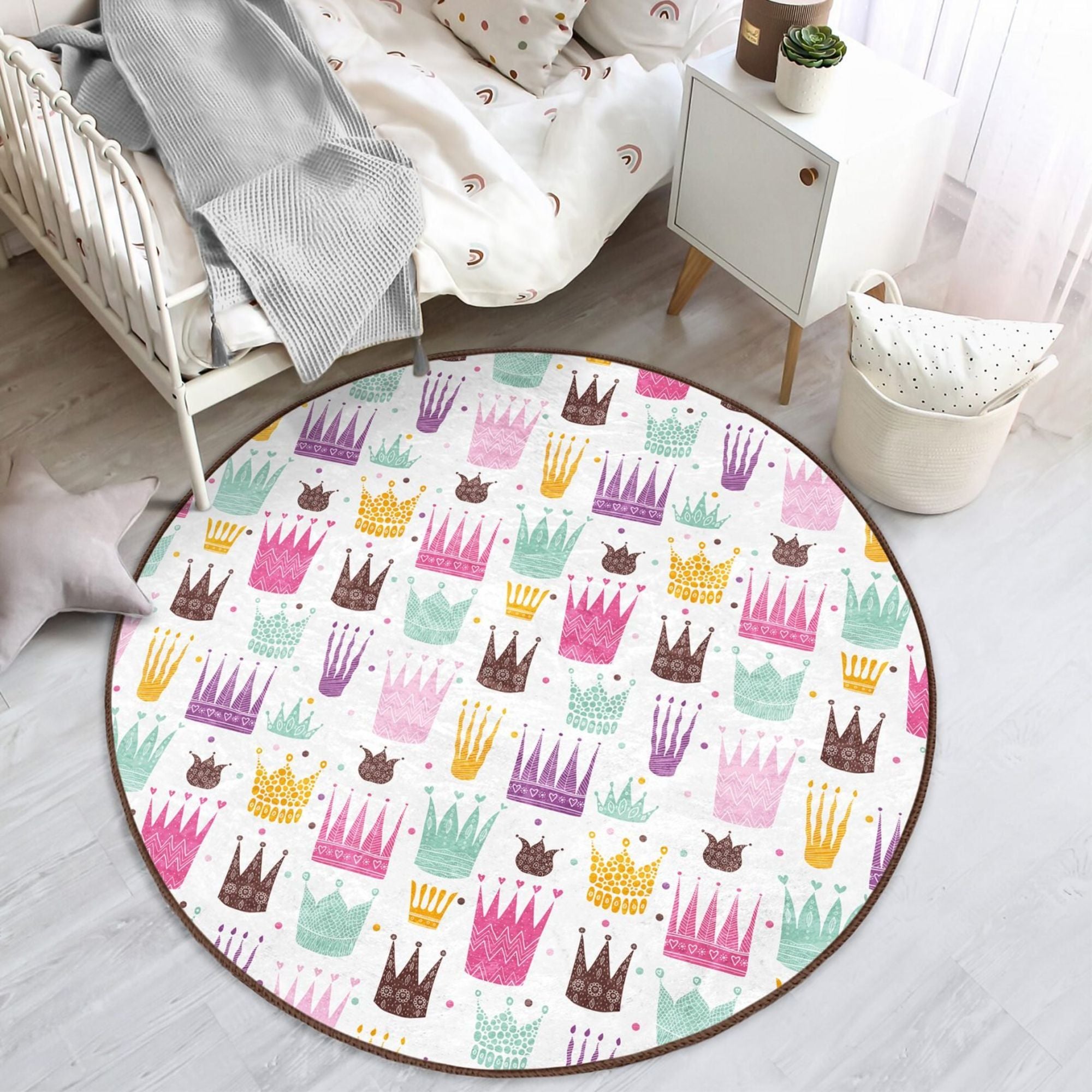 A beautiful washable rug featuring a princess crown pattern, perfect for a girl's room, made from high-quality polyester with vibrant colors.