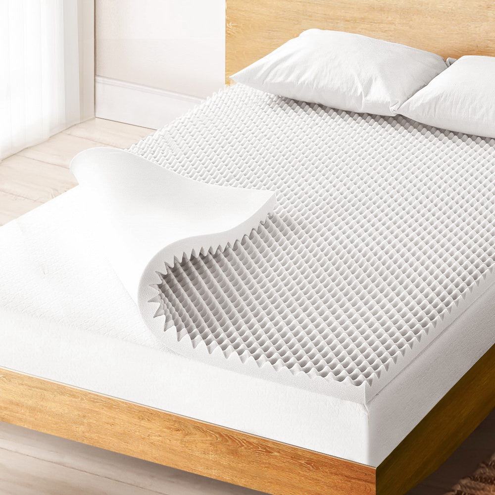 Giselle Bedding Egg Crate Foam Mattress Topper showcasing its unique design and thickness for enhanced comfort.