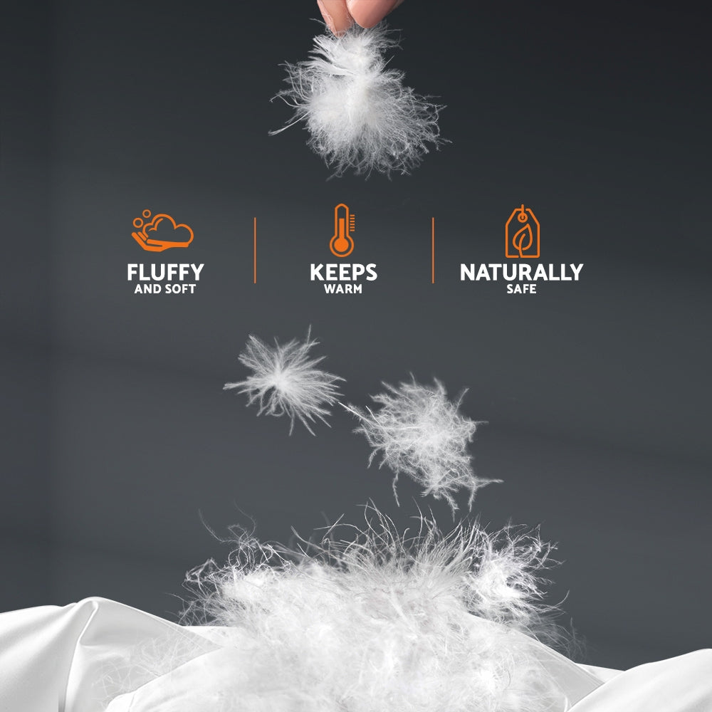 Giselle Bedding Super King 700GSM Goose Down Feather Quilt displayed on a bed, showcasing its luxurious white cotton cover and plush filling.