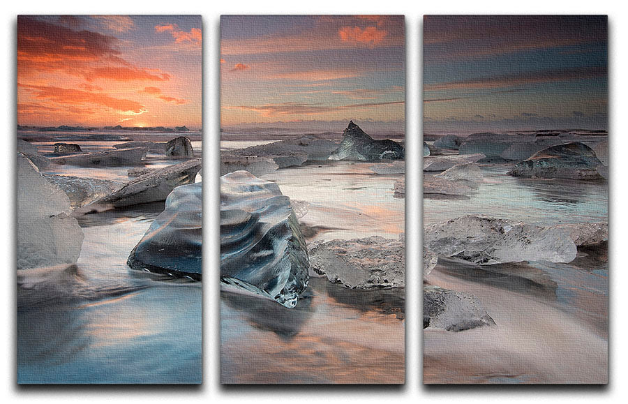 A stunning 3-panel canvas print featuring a serene glacial lagoon beach scene, perfect for home decor.