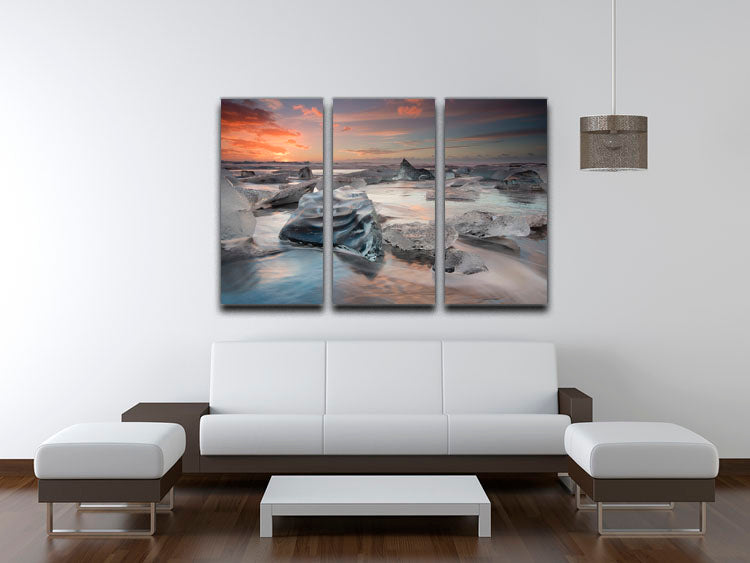 A stunning 3-panel canvas print featuring a serene glacial lagoon beach scene, perfect for home decor.