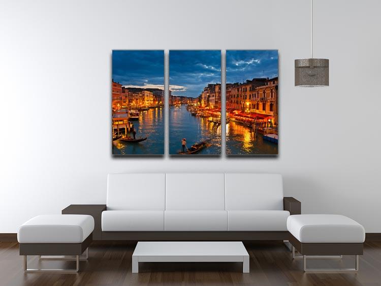 A stunning 3-panel canvas print depicting the Grand Canal in Venice at night, showcasing illuminated buildings and serene water reflections.