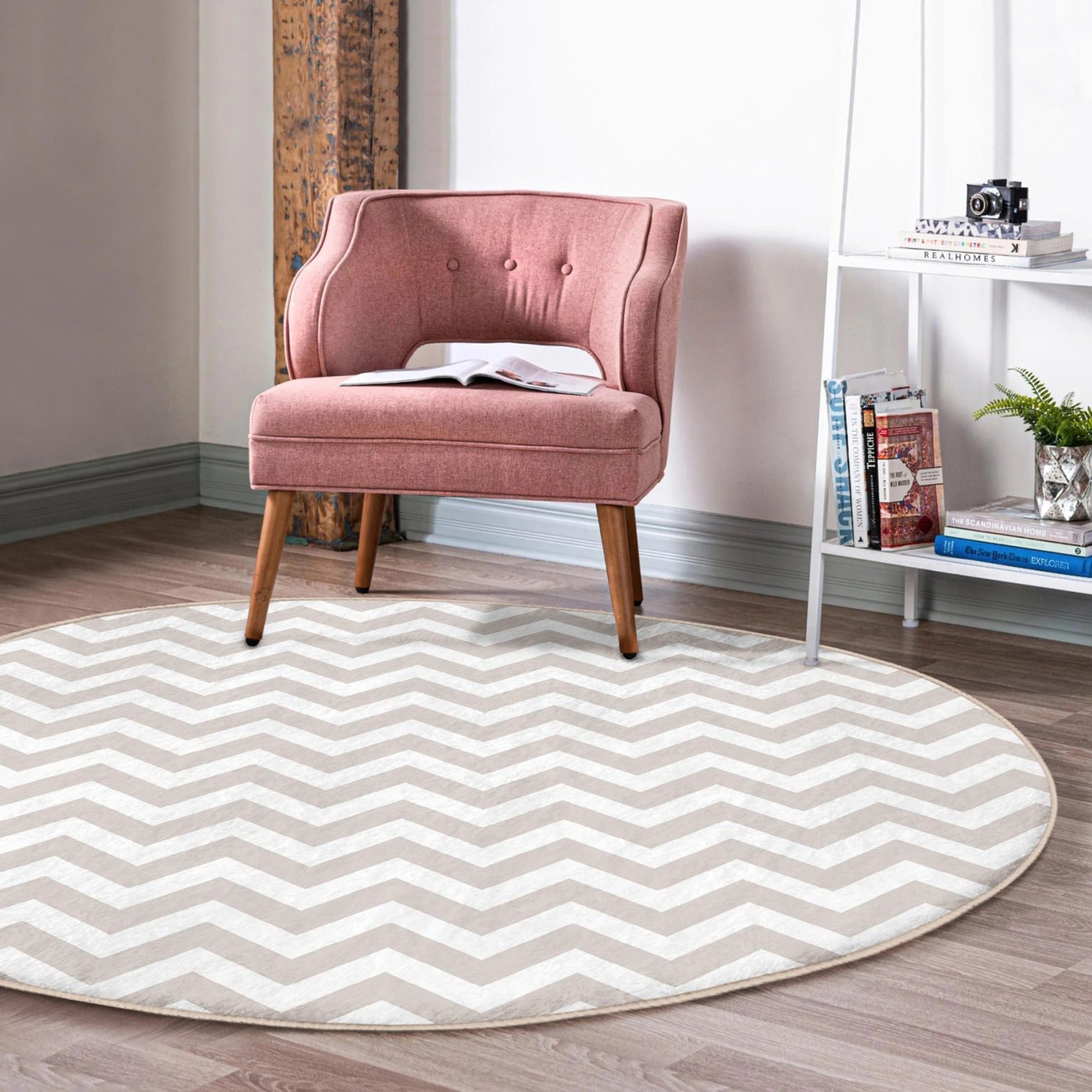Gray and white decorative round rug placed in a stylish living room setting, showcasing its elegant design and soft texture.