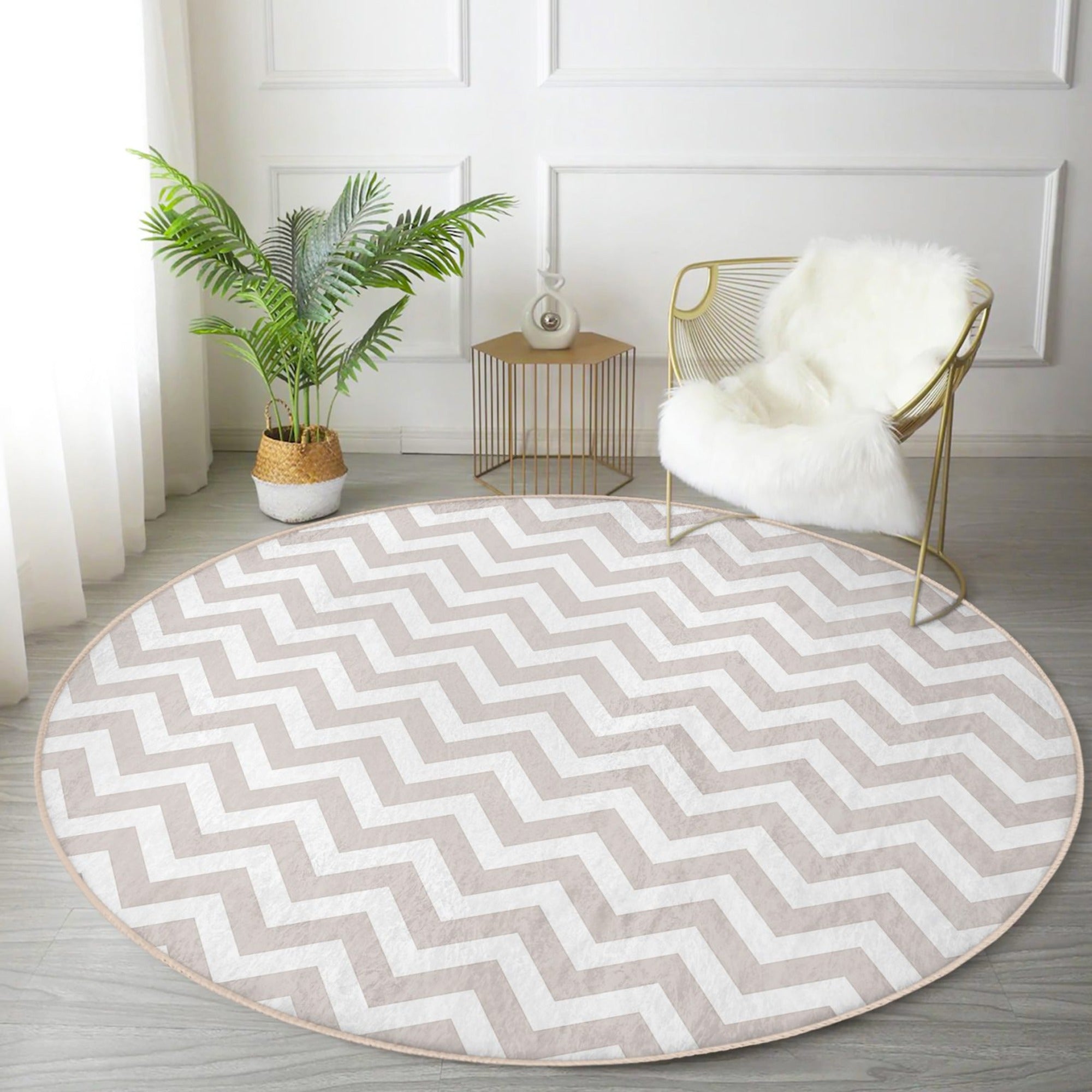 Gray and white decorative round rug placed in a stylish living room setting, showcasing its elegant design and soft texture.