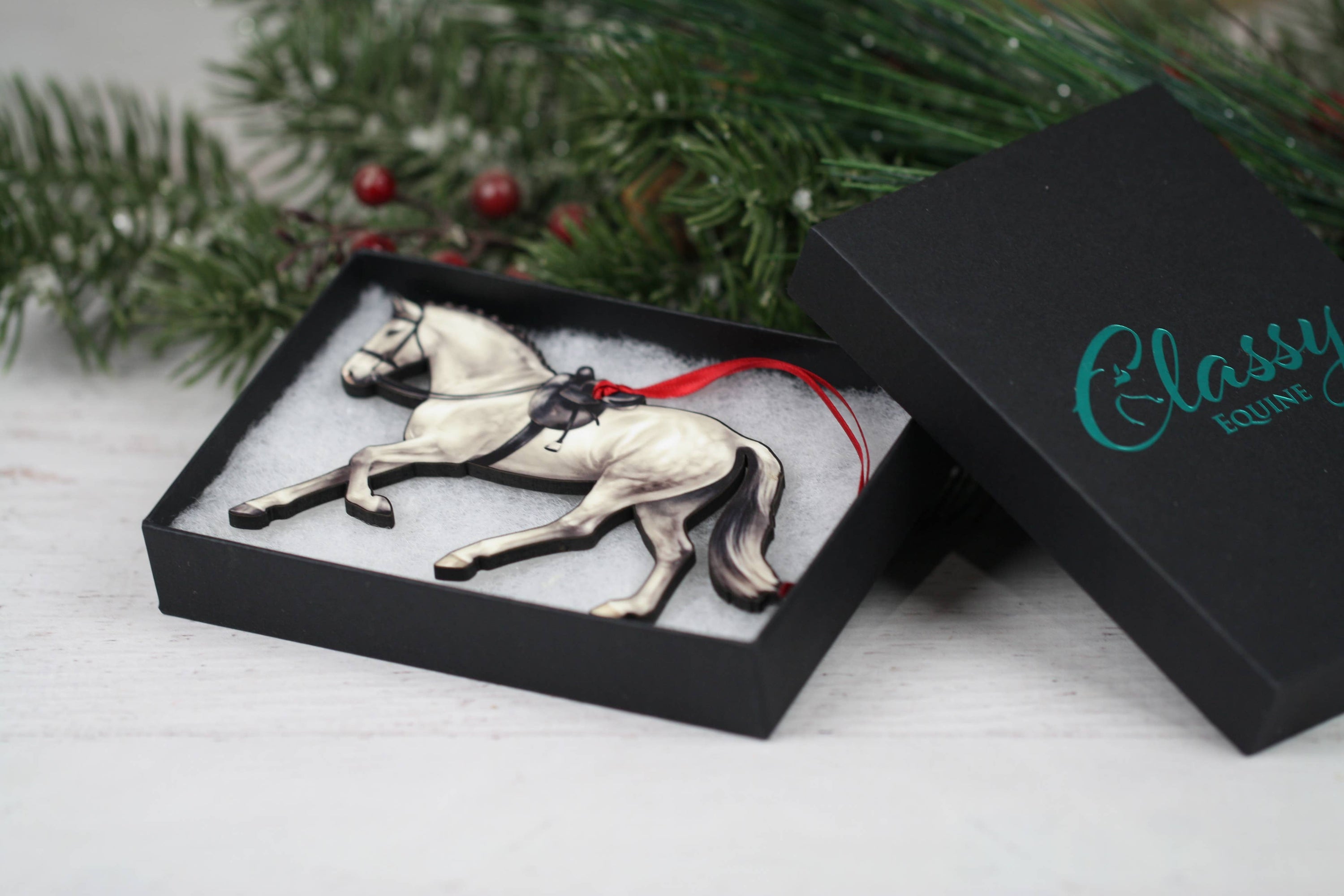 Gray Horse Christmas Decoration, a side saddle ornament made of composite wood, featuring a glossy front and dark brown back, perfect for holiday decor.