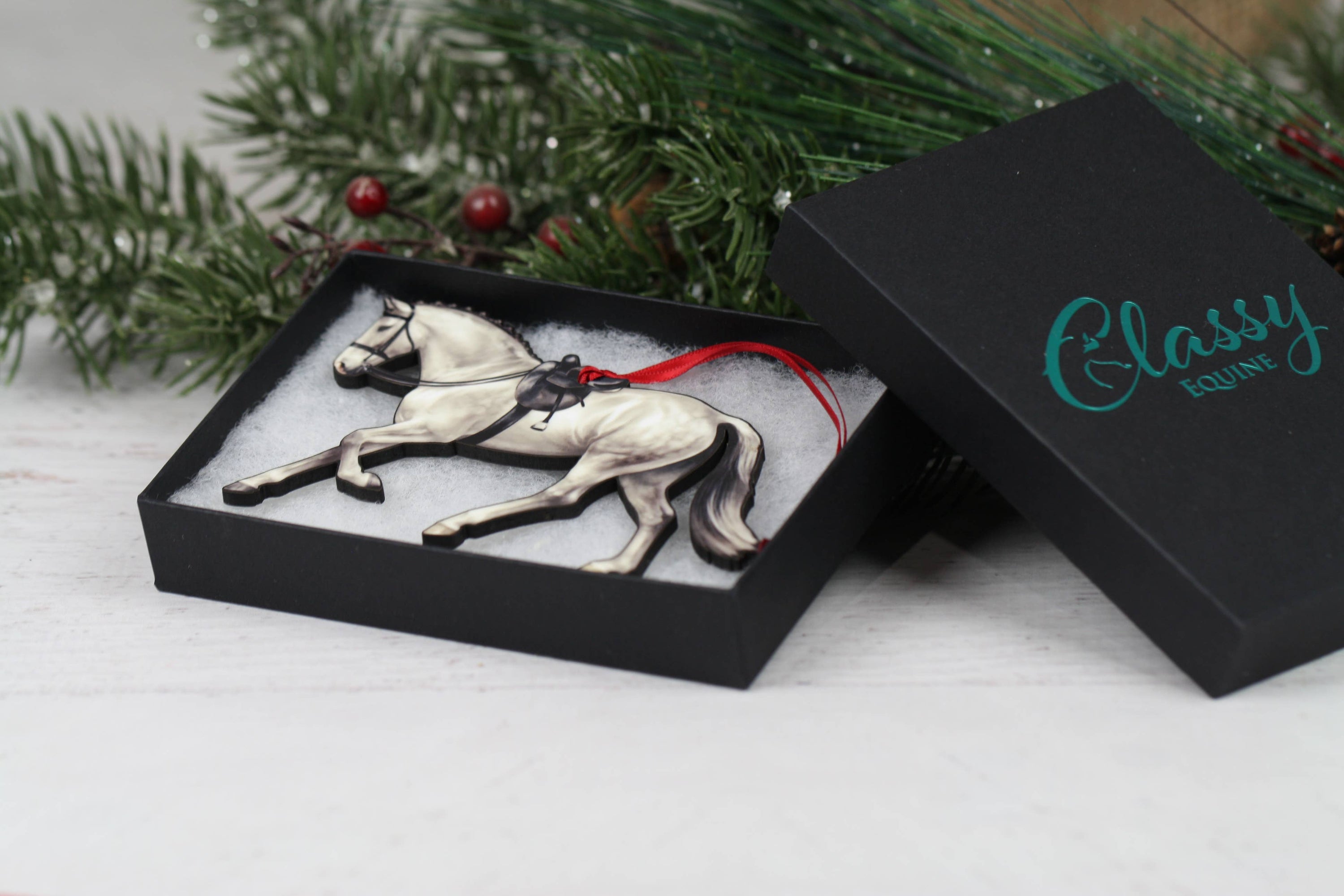 Gray Horse Christmas Decoration, a side saddle ornament made of composite wood, featuring a glossy front and dark brown back, perfect for holiday decor.