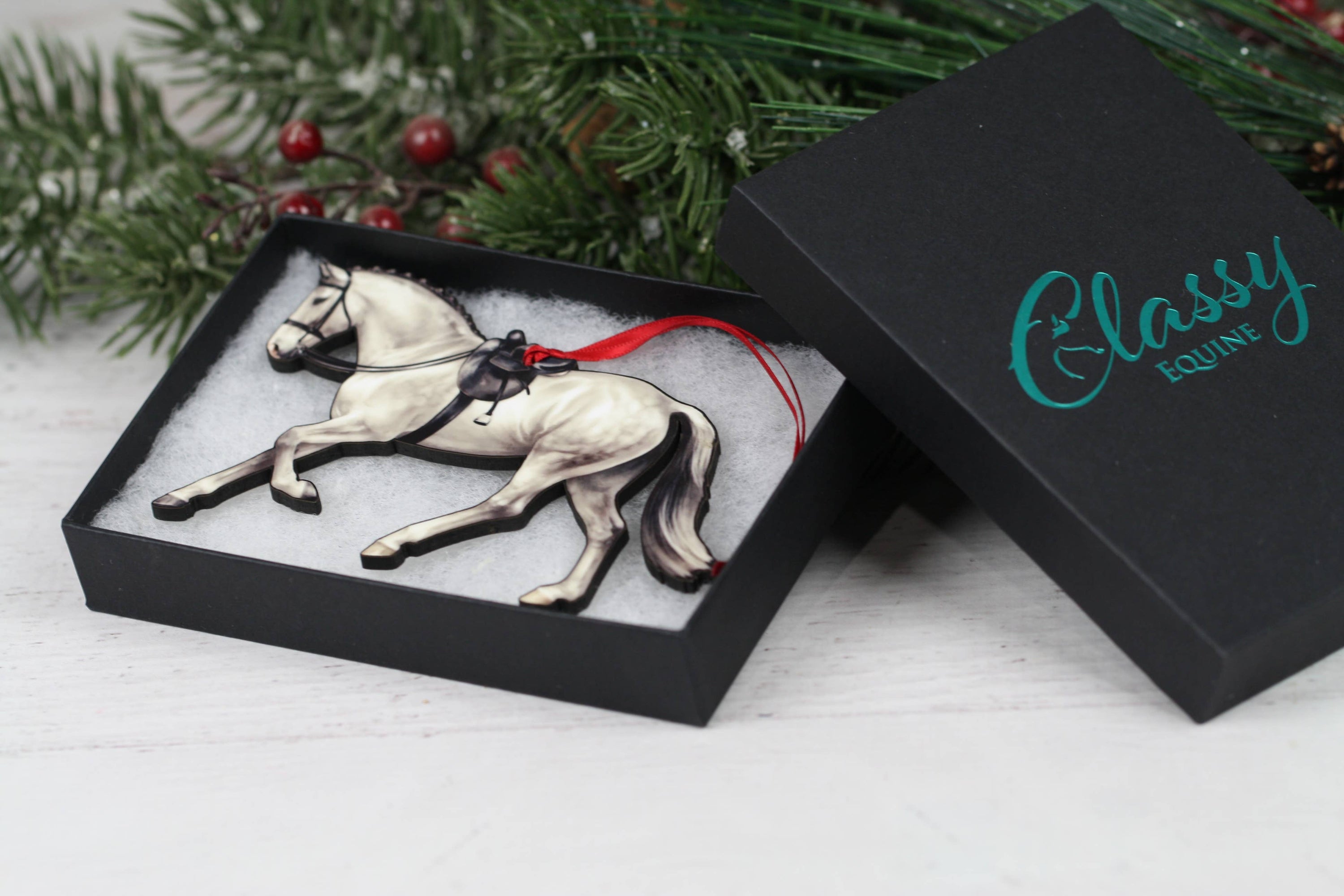 Gray Horse Christmas Decoration, a side saddle ornament made of composite wood, featuring a glossy front and dark brown back, perfect for holiday decor.