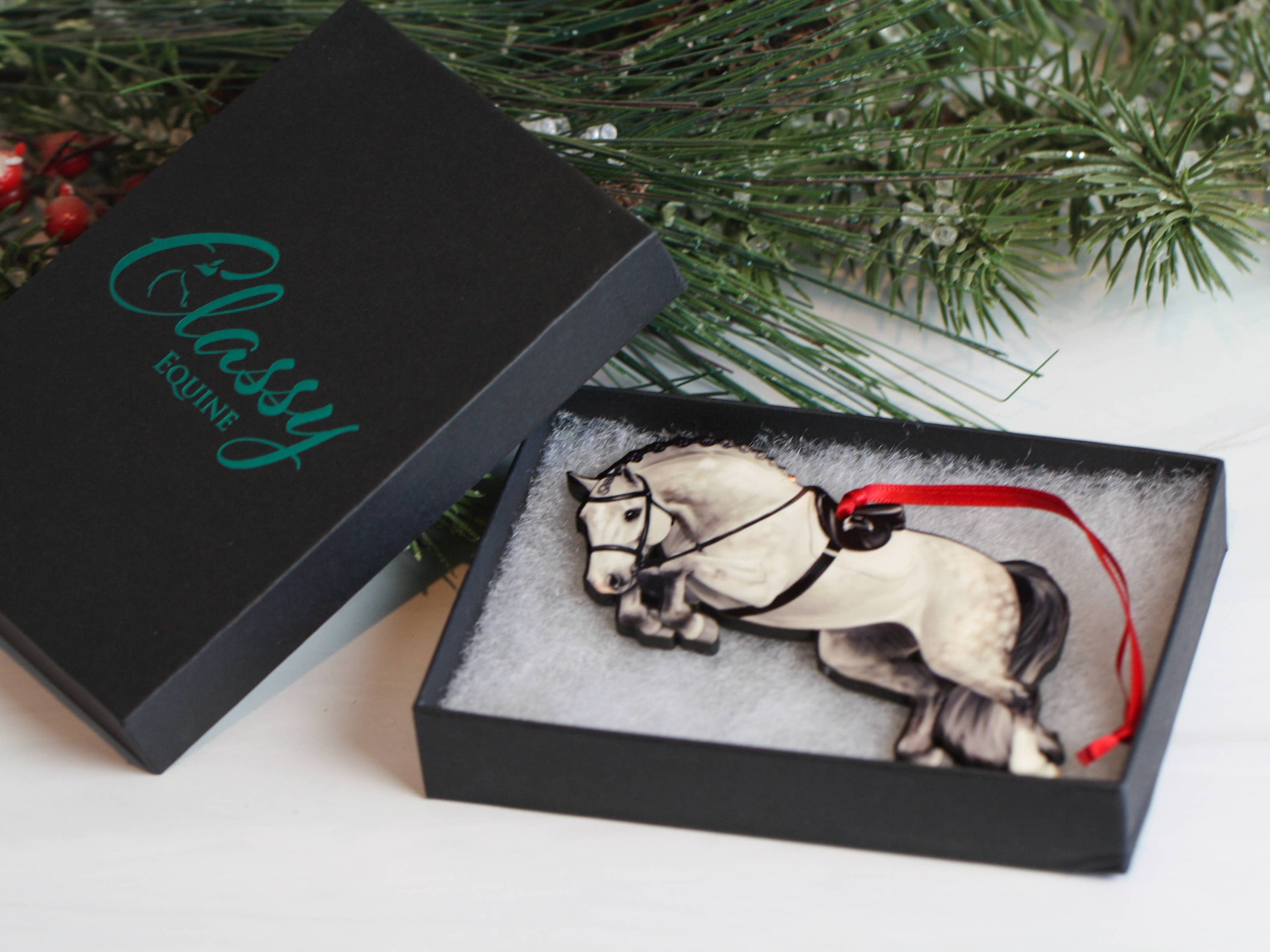 Gray Hunter Equestrian Decor Jumping Horse Ornament with braided mane, featuring a glossy front and dark brown back, perfect for holiday decor.