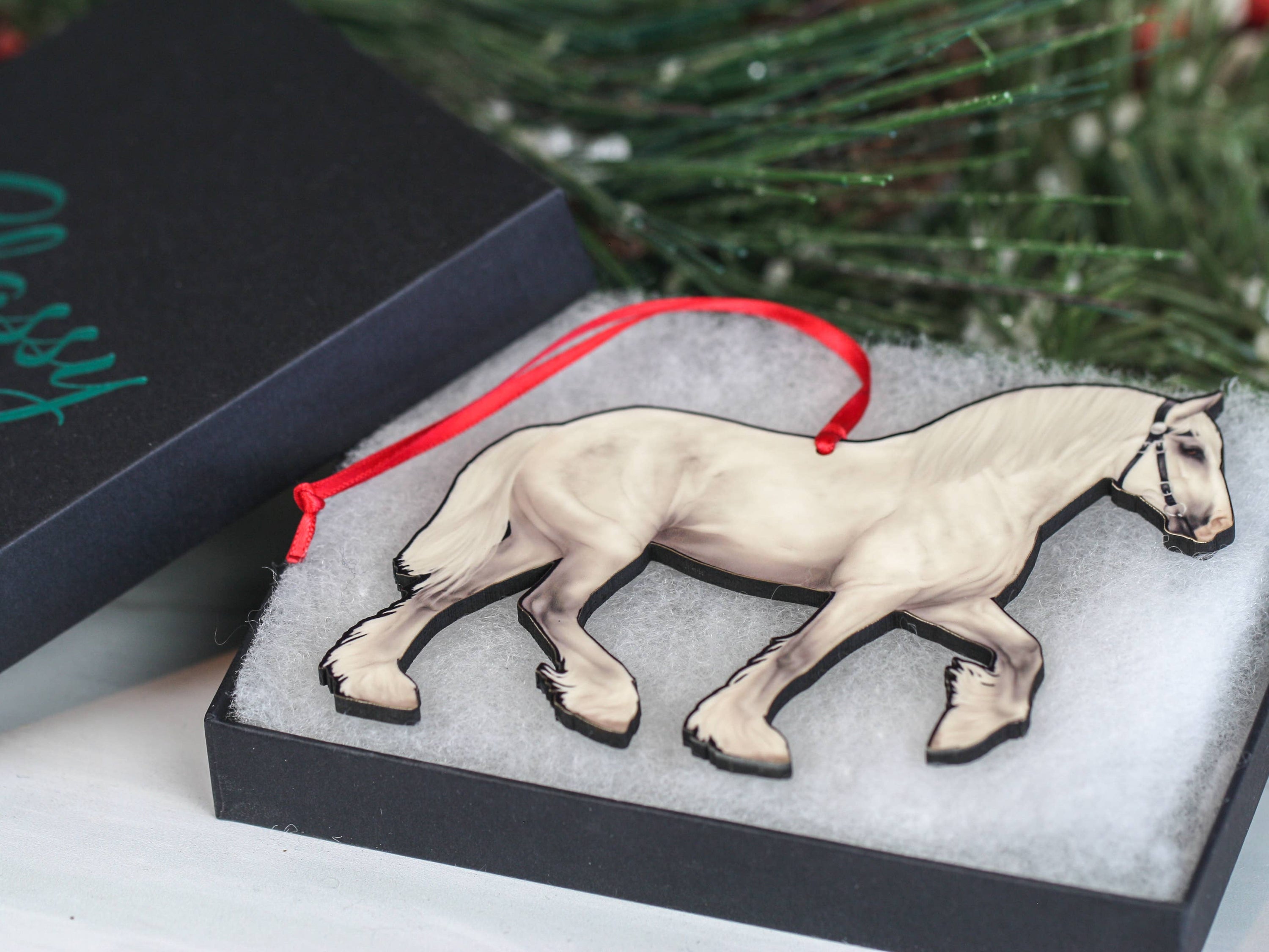 Gray Shire Draft Horse Christmas Ornament with red and black ribbons, showcasing intricate laser-cut design on composite wood.