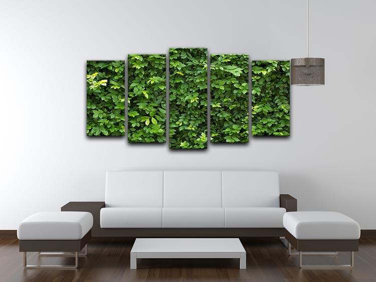 A beautiful 5-panel canvas artwork featuring lush green leaves, creating a serene and vibrant atmosphere.