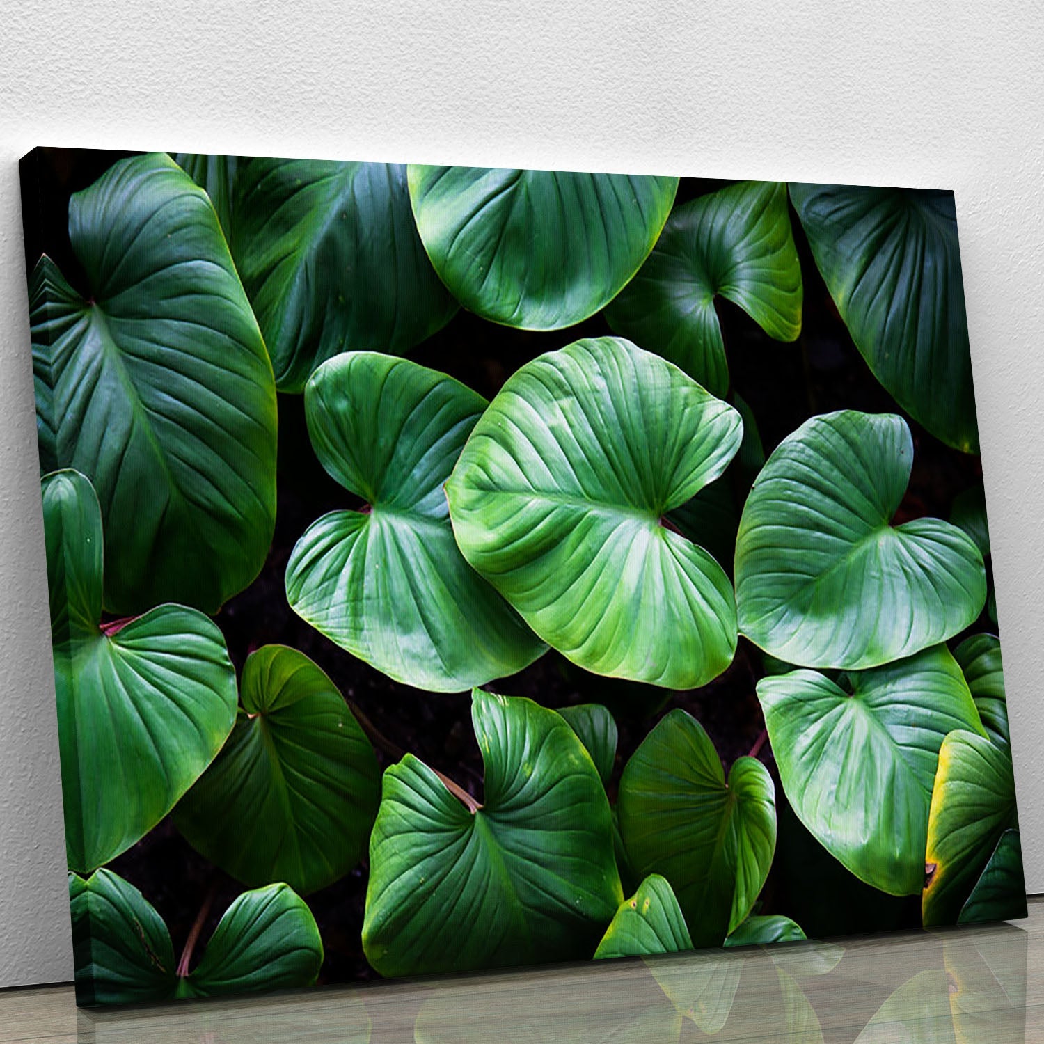 A vibrant green plant canvas print showcasing detailed foliage, perfect for home or office decor.