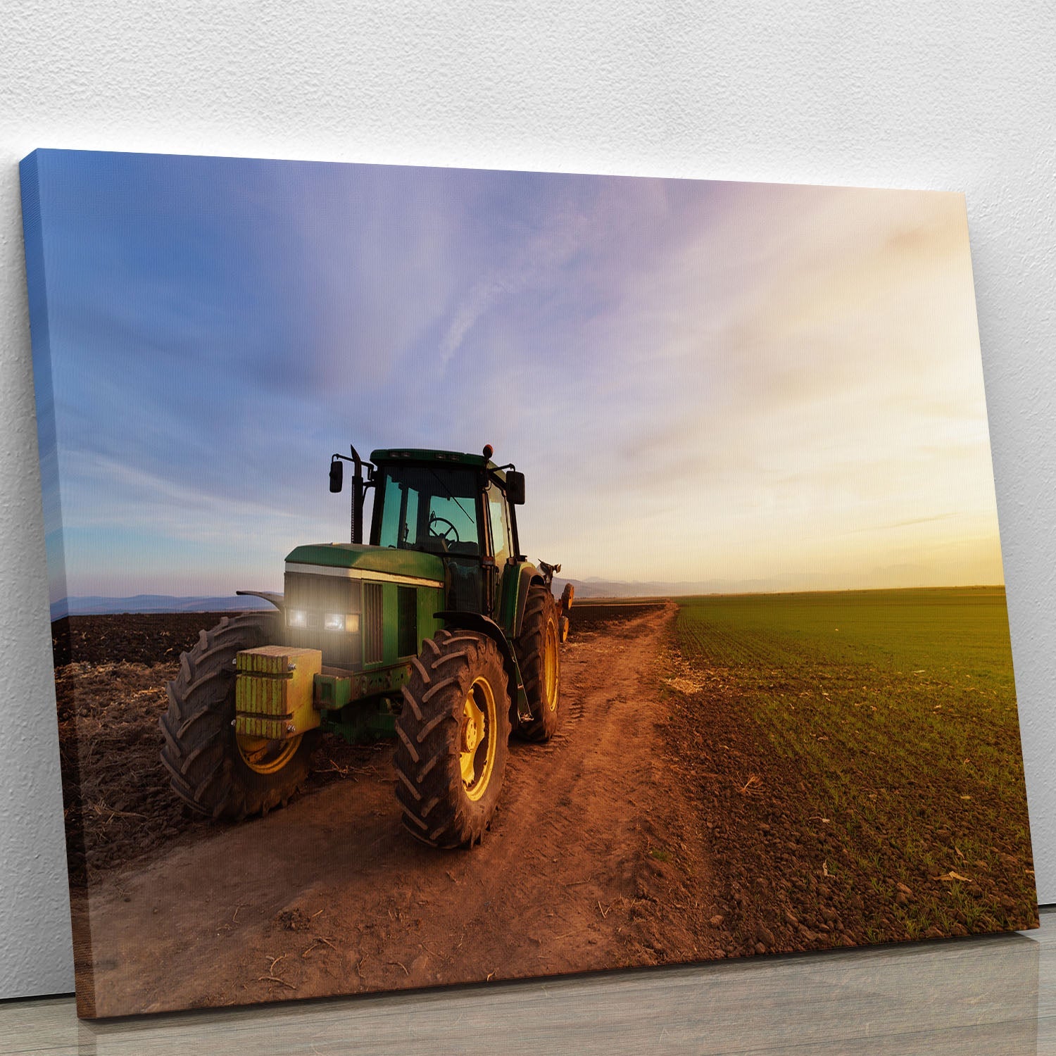A vibrant green tractor canvas print showcasing intricate details and rich colors, perfect for home or office decor.