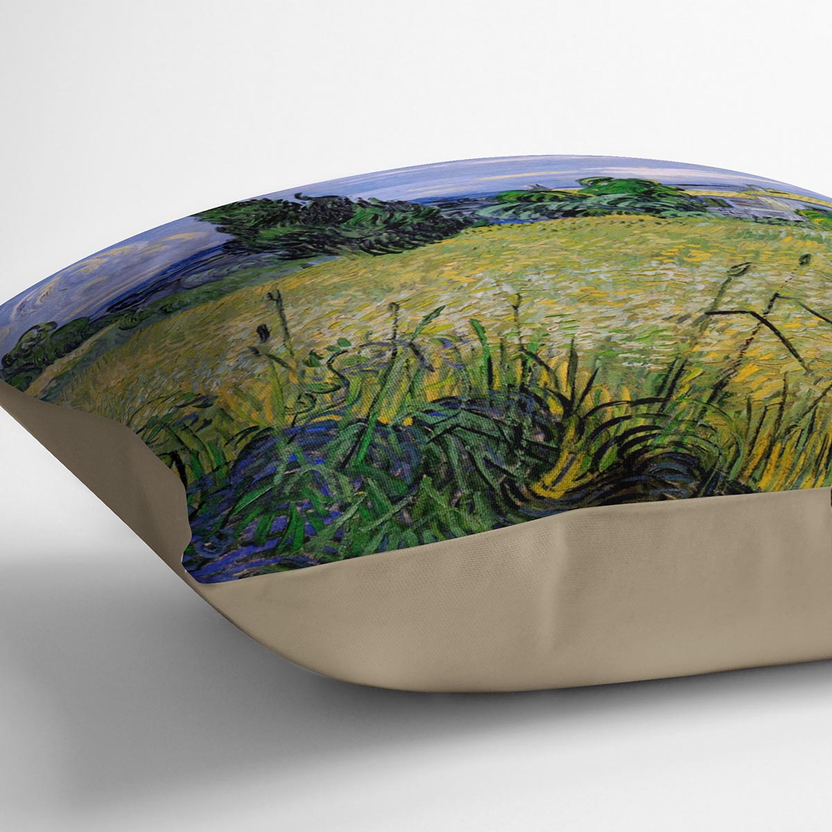 A vibrant cushion featuring Van Gogh's Green Wheat Field with Cypress design, made from luxurious vegan faux suede.