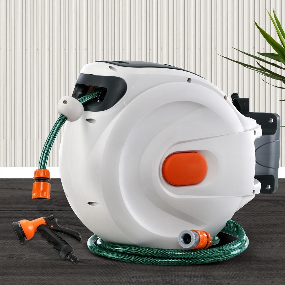 Greenfingers Retractable Hose Reel with 30M hose and spray gun, showcasing a compact design and wall-mounted feature.