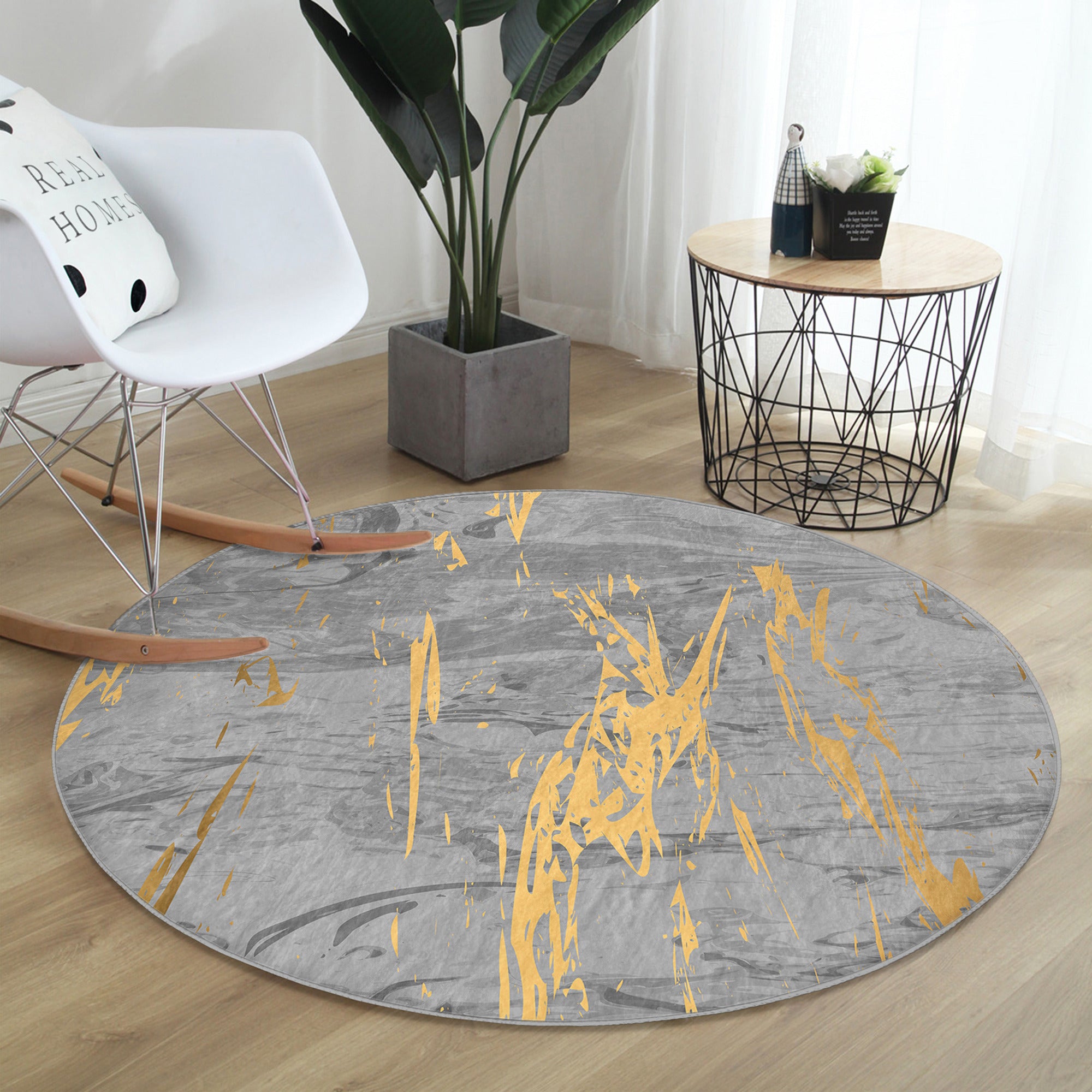 A stylish grey marble pattern round rug with gold lines, showcasing its soft velvet texture and elegant design, perfect for home decor.
