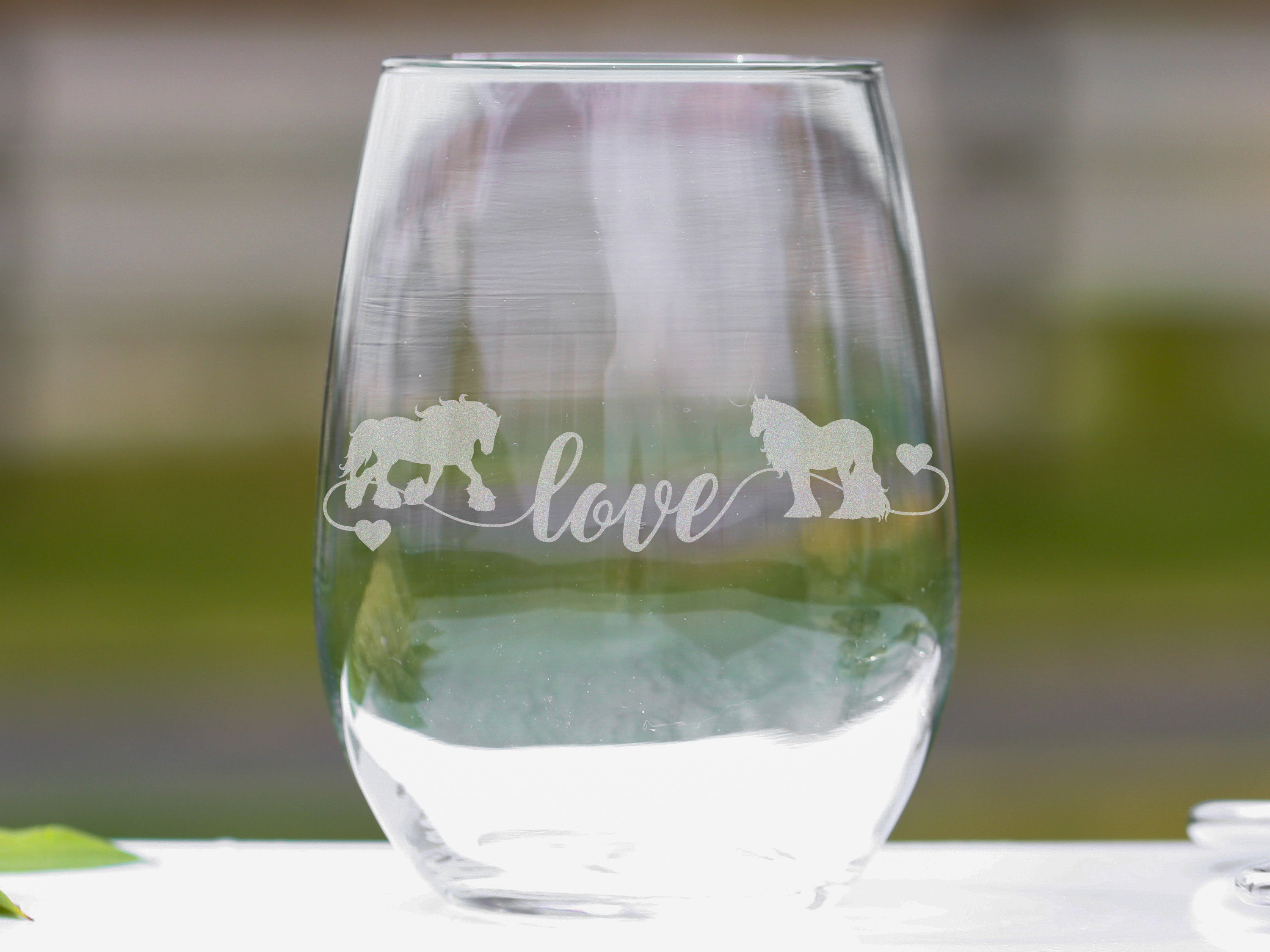 Set of Gypsy Horse Love stemless wine glasses featuring elegant horse artwork, perfect for wine lovers.
