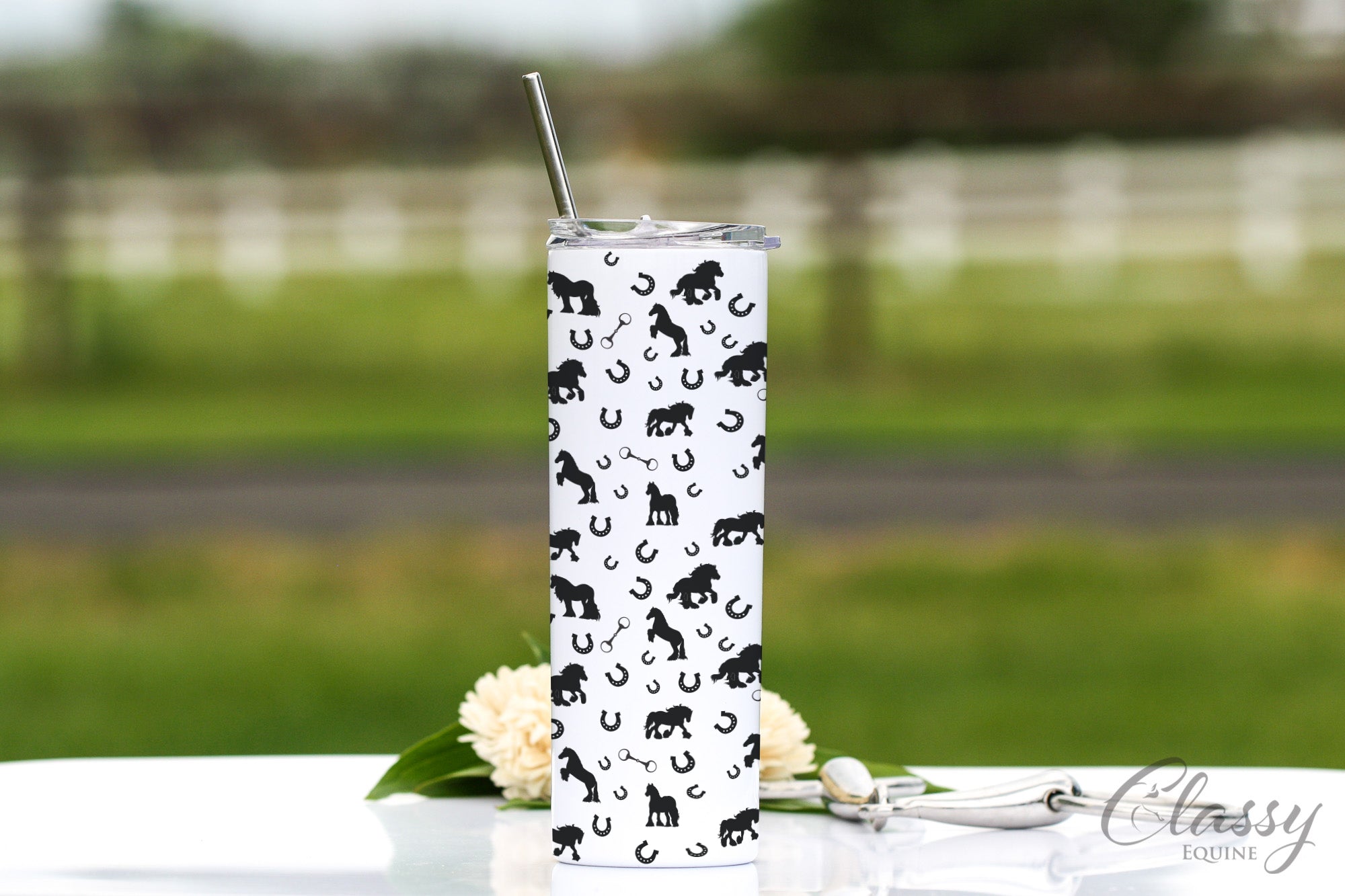 Gypsy Horses All Around 20 oz skinny tumbler featuring horse silhouettes and snaffle bit design, with a stainless steel straw and lid.