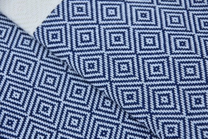 A beautifully designed Hammam towel made from 100% Turkish cotton, featuring a classic herringbone pattern, perfect for beach, yoga, and home use.