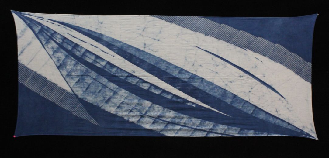 Hand Printed Cotton Textiles featuring floral designs in indigo dye on a white base, showcasing intricate patterns and craftsmanship.