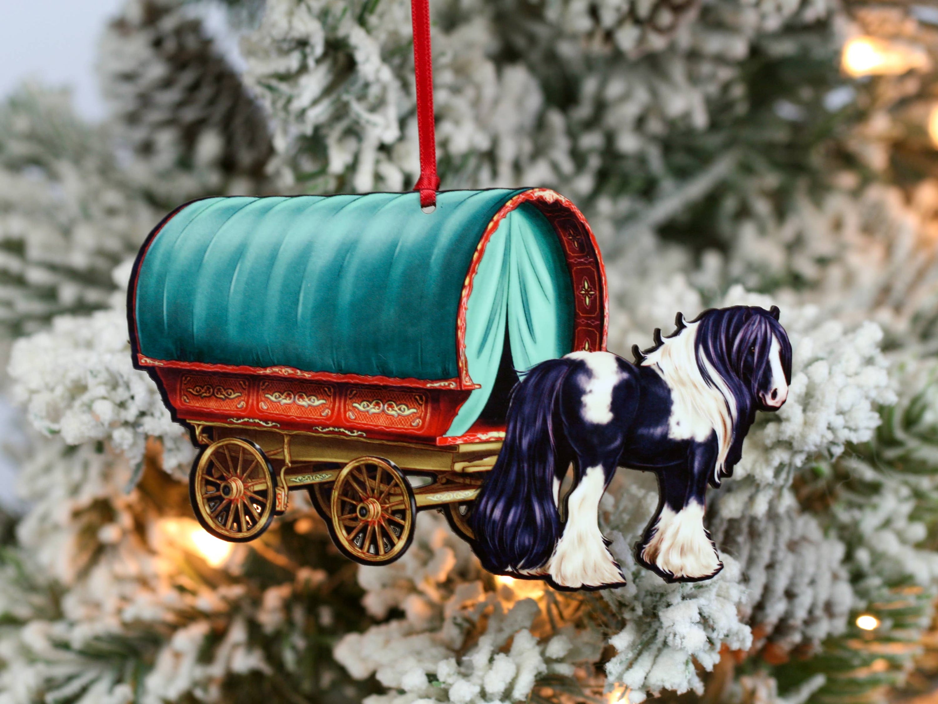 Handcrafted Gypsy Cob horse wagon ornament in black and white, featuring intricate details and glossy finish, perfect for Christmas decor.