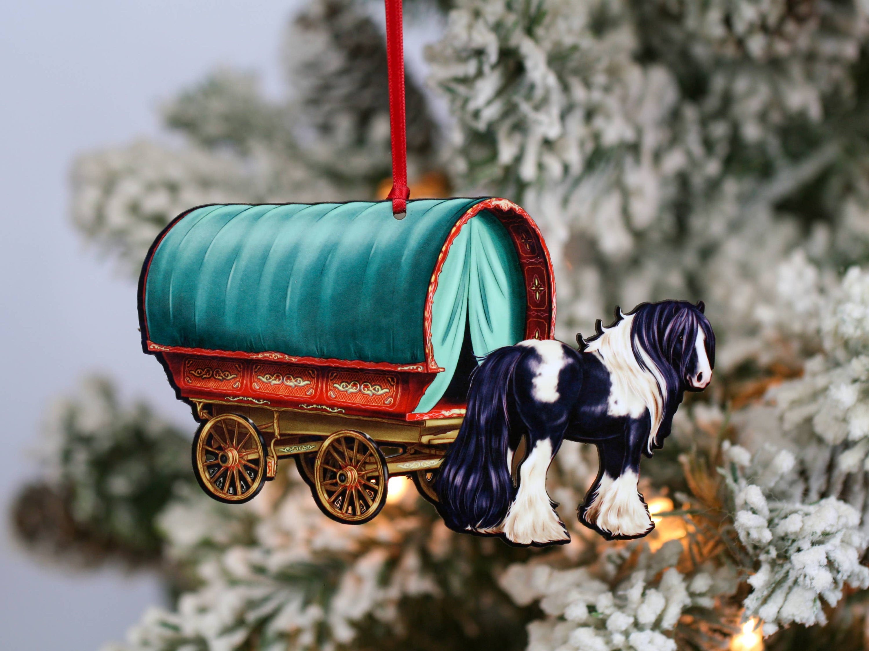 Handcrafted Gypsy Cob horse wagon ornament in black and white, featuring intricate details and glossy finish, perfect for Christmas decor.