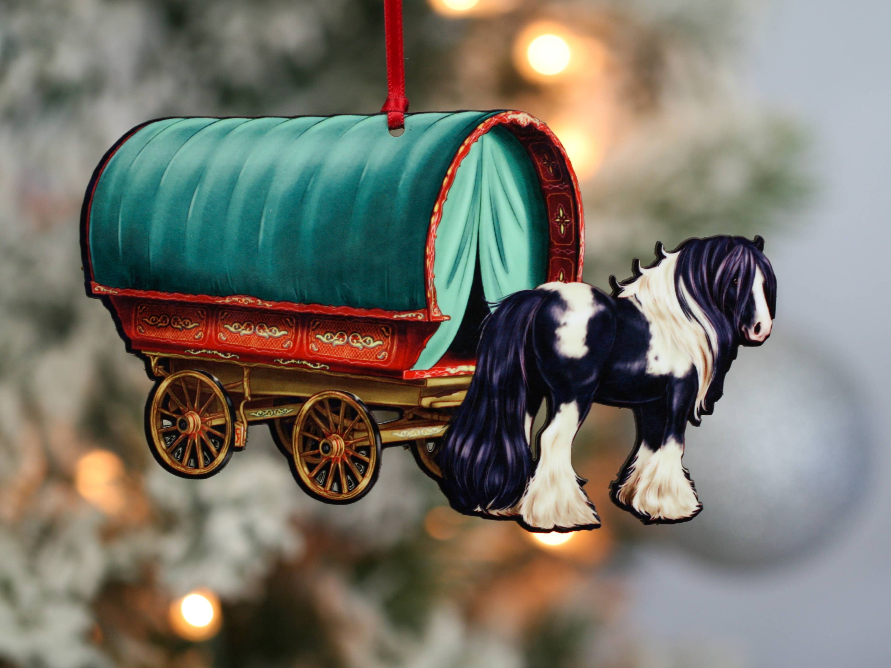 Handcrafted Gypsy Cob horse wagon ornament in black and white, featuring intricate details and glossy finish, perfect for Christmas decor.