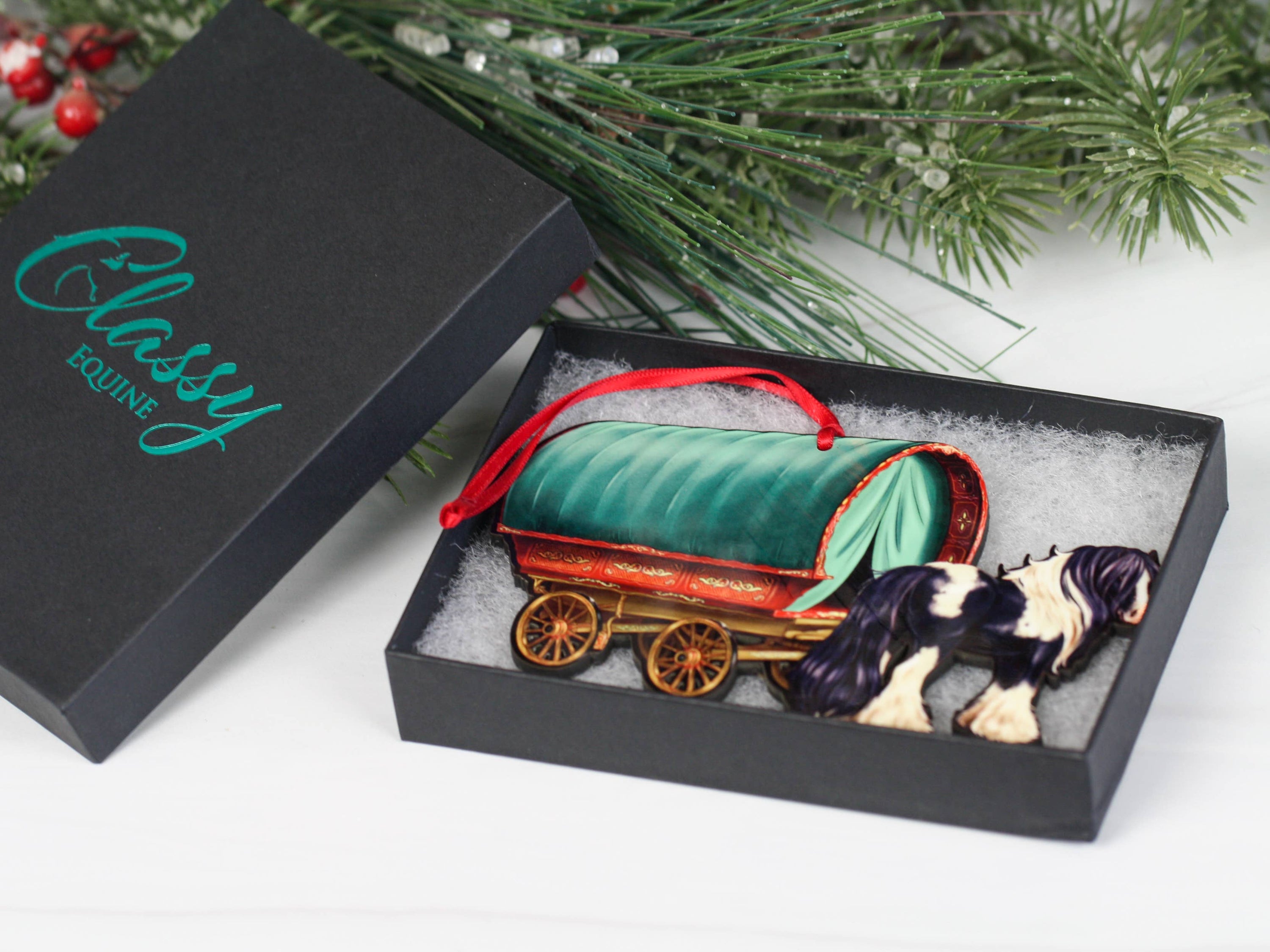 Handcrafted Gypsy Cob horse wagon ornament in black and white, featuring intricate details and glossy finish, perfect for Christmas decor.