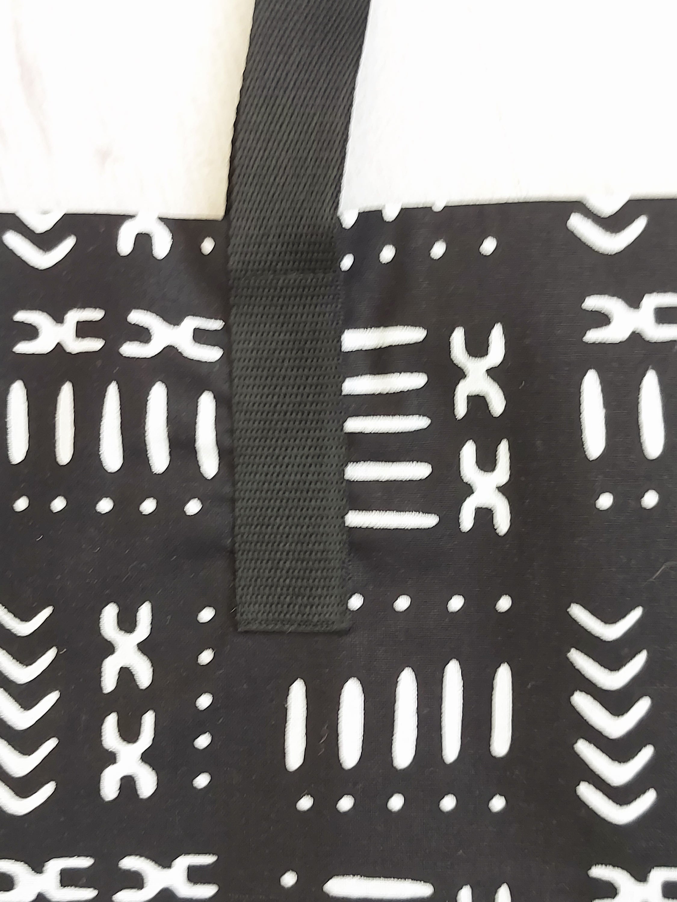 Handmade African Print Tote Bag featuring vibrant patterns, long handles, and durable cotton fabric, perfect for shopping and beach outings.