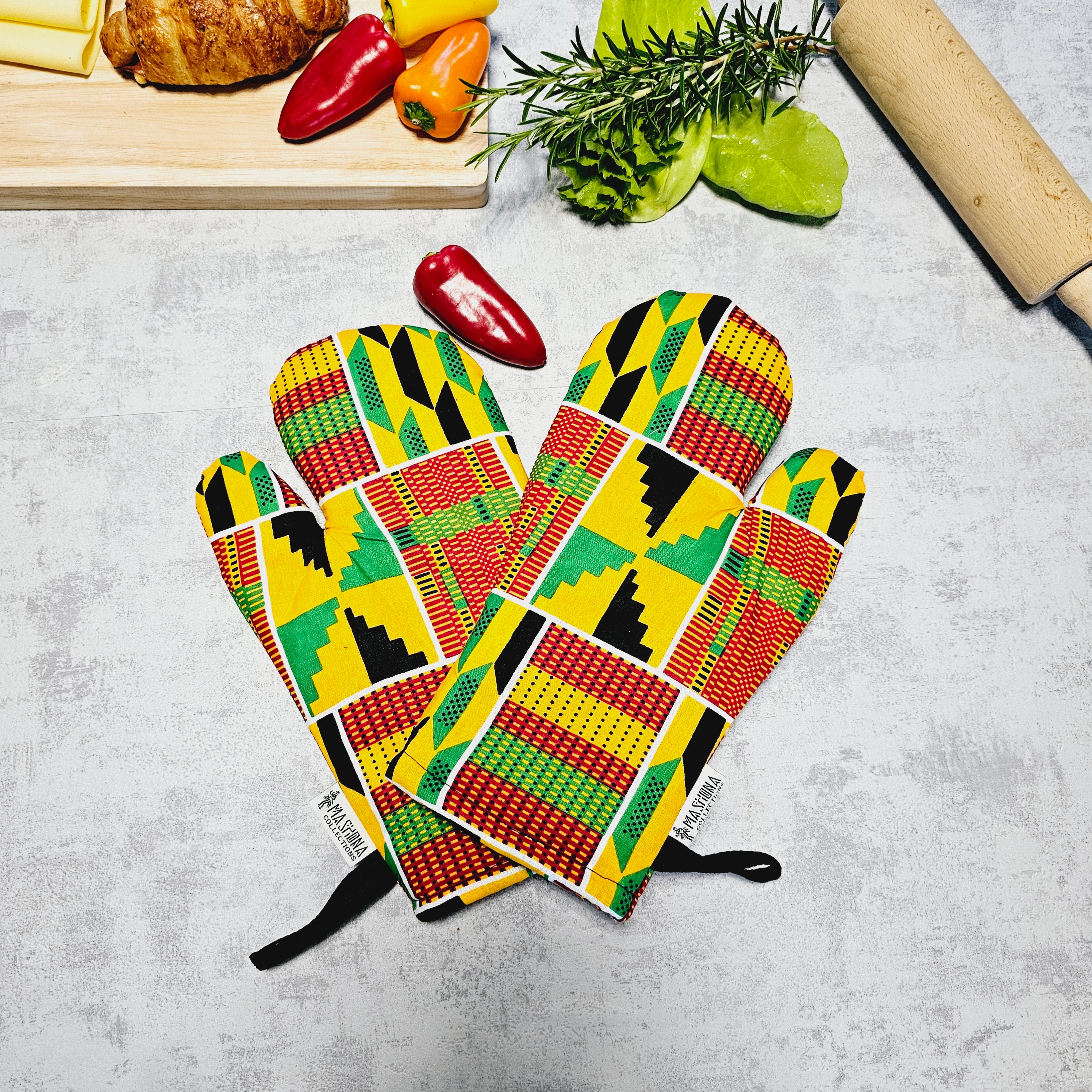 Handmade African Print Apron with matching oven gloves, showcasing vibrant colors and deep pockets, crafted from 100% cotton.