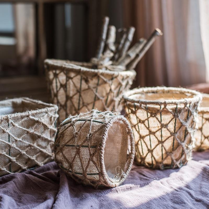 A set of three handmade hemp baskets in various sizes and colors, showcasing their natural texture and eco-friendly design.