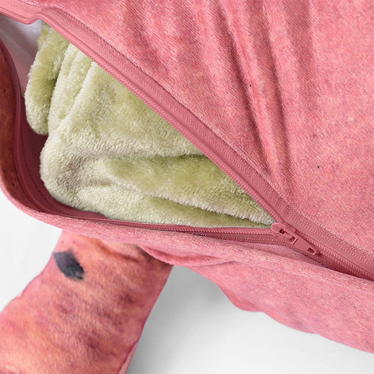 Happy Kids Dino Novelty Cushion shaped like a stegosaurus in pink, green, and charcoal colors, featuring a soft throw inside.